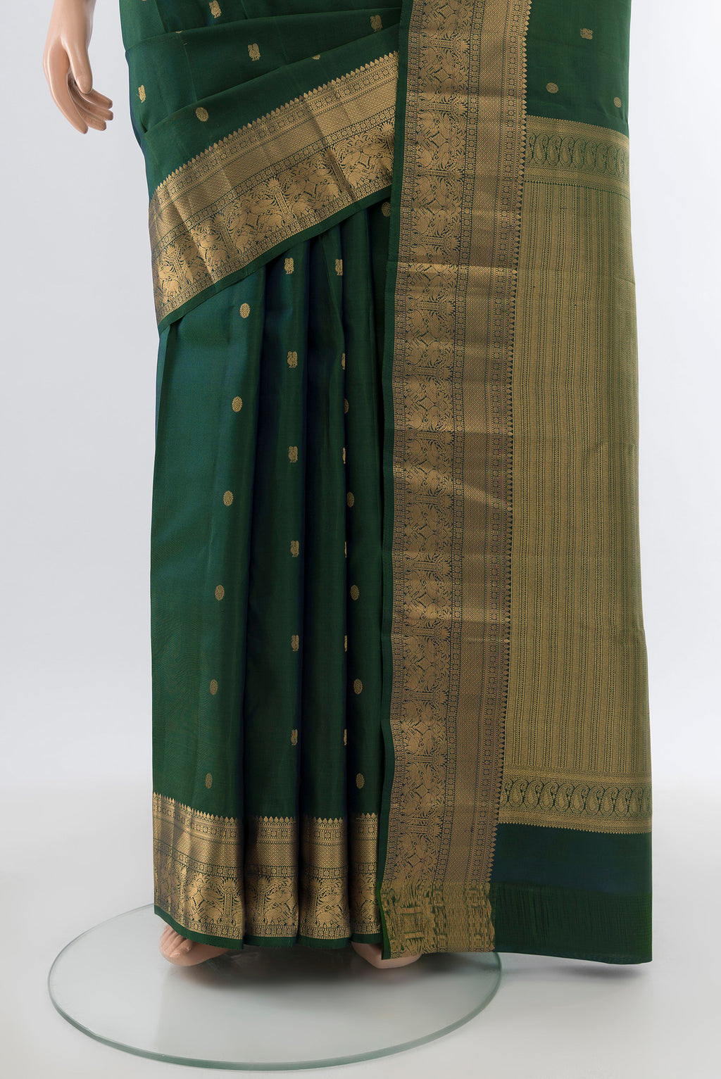 Pleats and pallu of Pure Silk Pure Zari Bottle Green Kanchipuram Saree with Zari Butta on the body and Silk Border. 