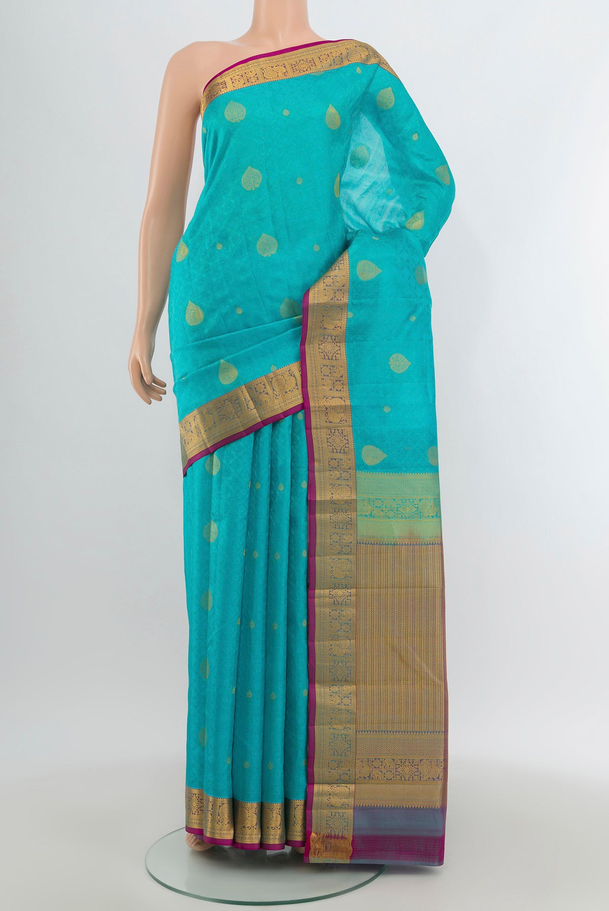 Light Blue Kanchipuram Silk Saree with Jacquard With Zari Butta on the body and Zari Border.  displayed on a mannequin