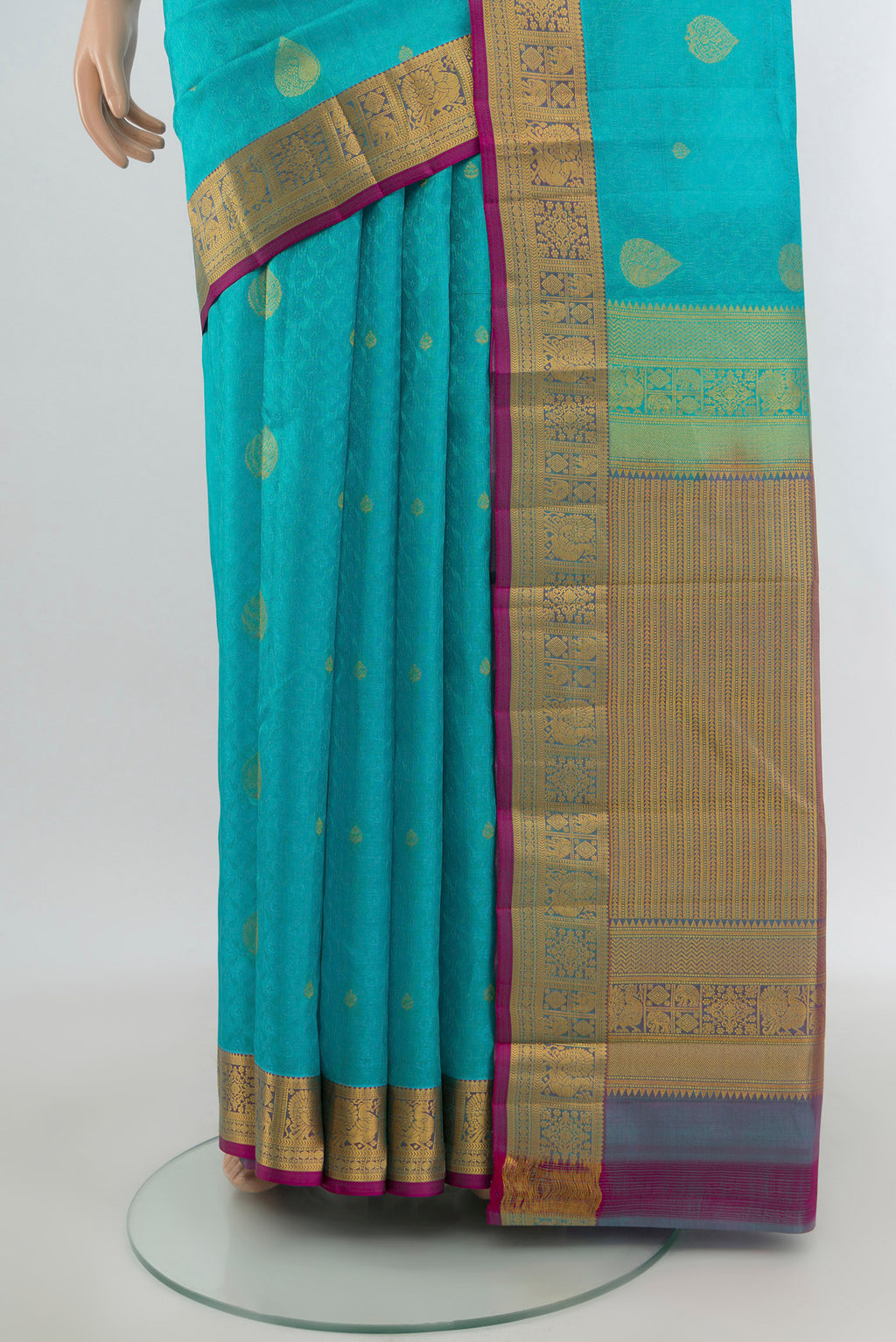 Pleats and pallu of Light Blue Kanchipuram Silk Saree with Jacquard With Zari Butta on the body and Zari Border. 