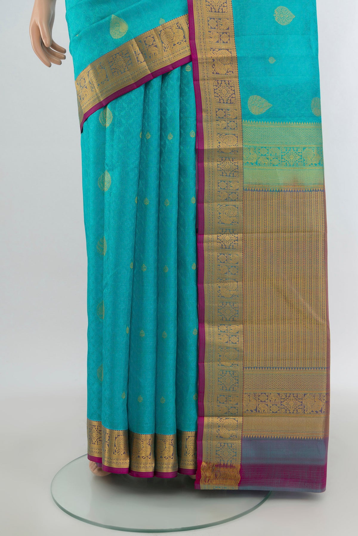 Pleats and pallu of Light Blue Kanchipuram Silk Saree with Jacquard With Zari Butta on the body and Zari Border. 