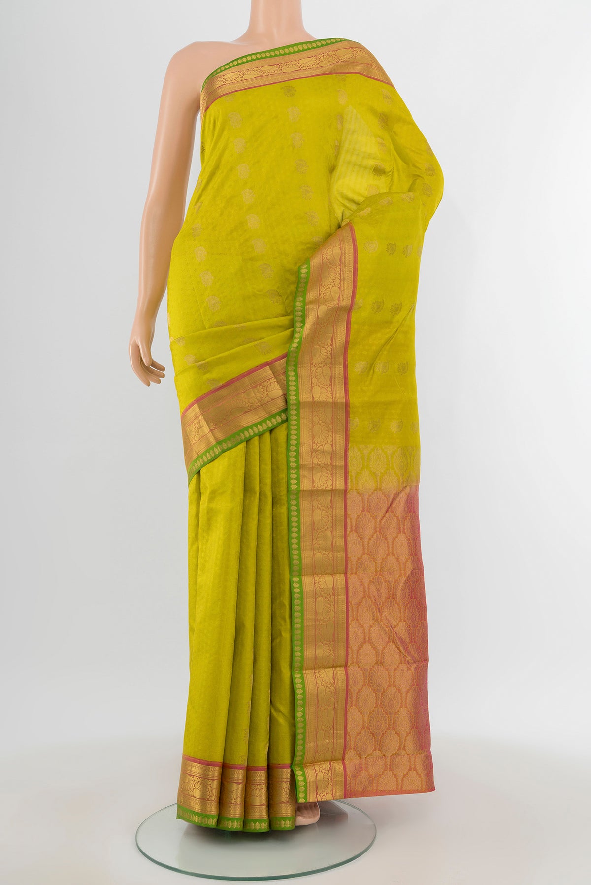 Parrot Green Kanchipuram Silk Saree with Jacquard With Zari Butta on the body and Zari Border.  displayed on a mannequin