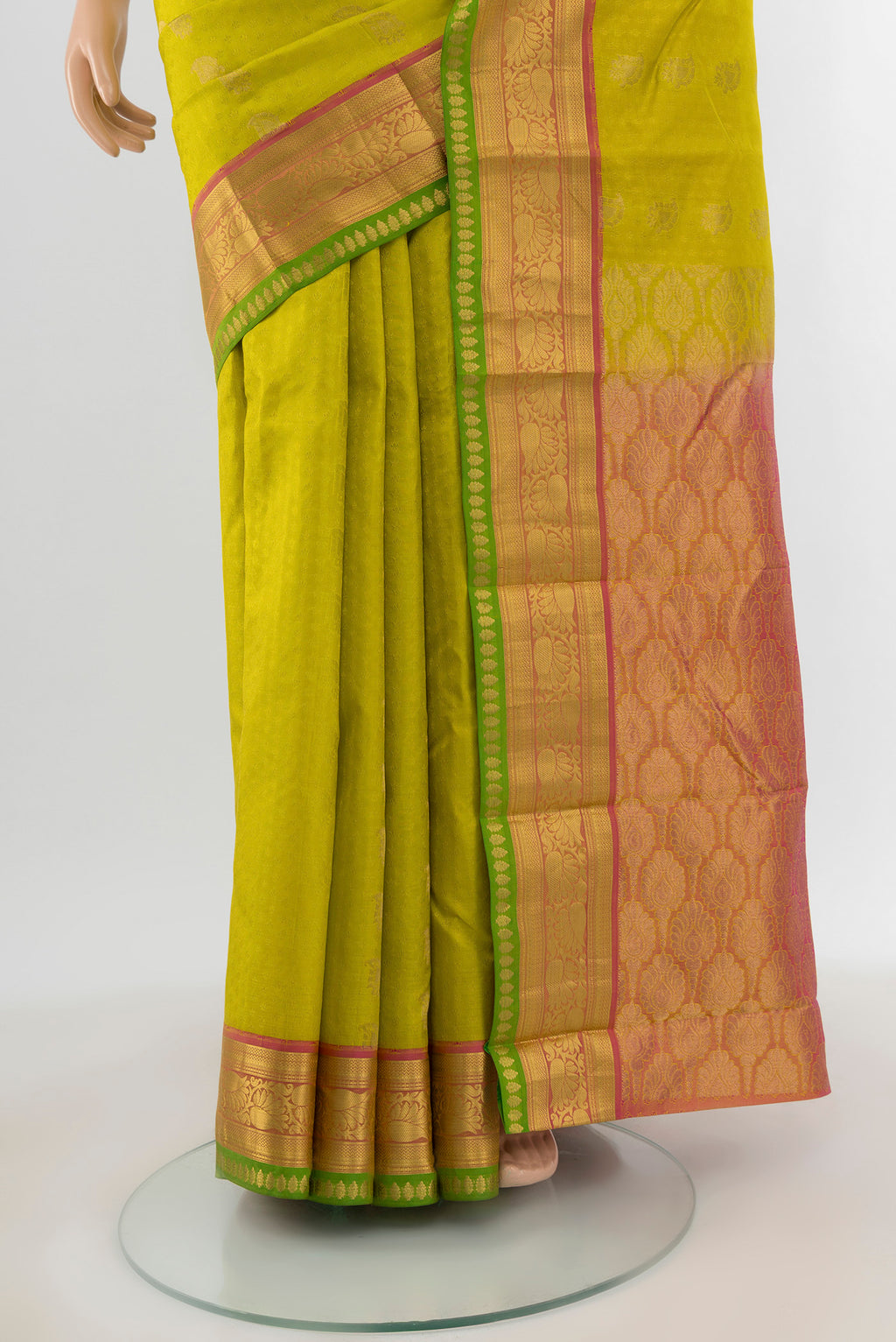 Pleats and pallu of Parrot Green Kanchipuram Silk Saree with Jacquard With Zari Butta on the body and Zari Border. 