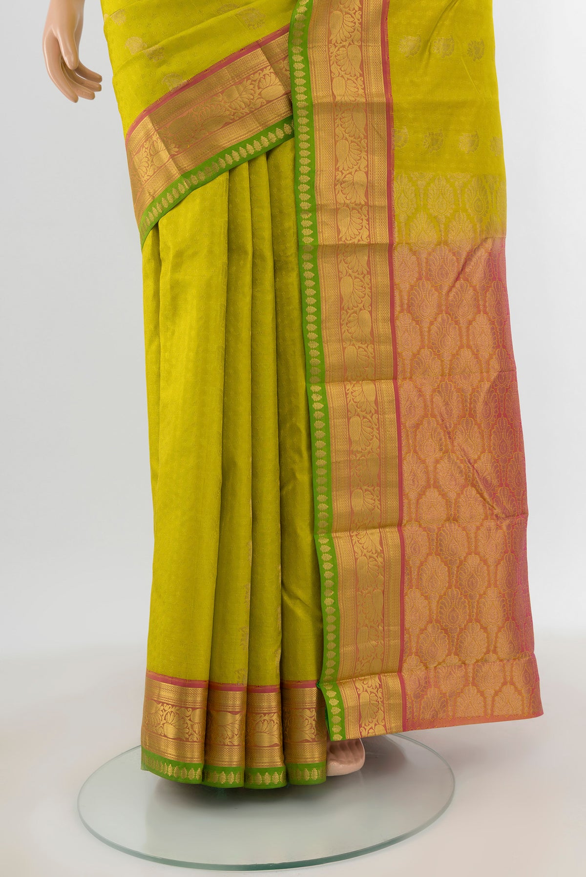 Pleats and pallu of Parrot Green Kanchipuram Silk Saree with Jacquard With Zari Butta on the body and Zari Border. 