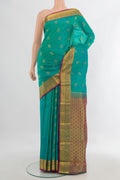Pure Silk Turquoise Kanchipuram Saree with Jacquard With Zari Butta on the body and Zari Border.  displayed on a mannequin