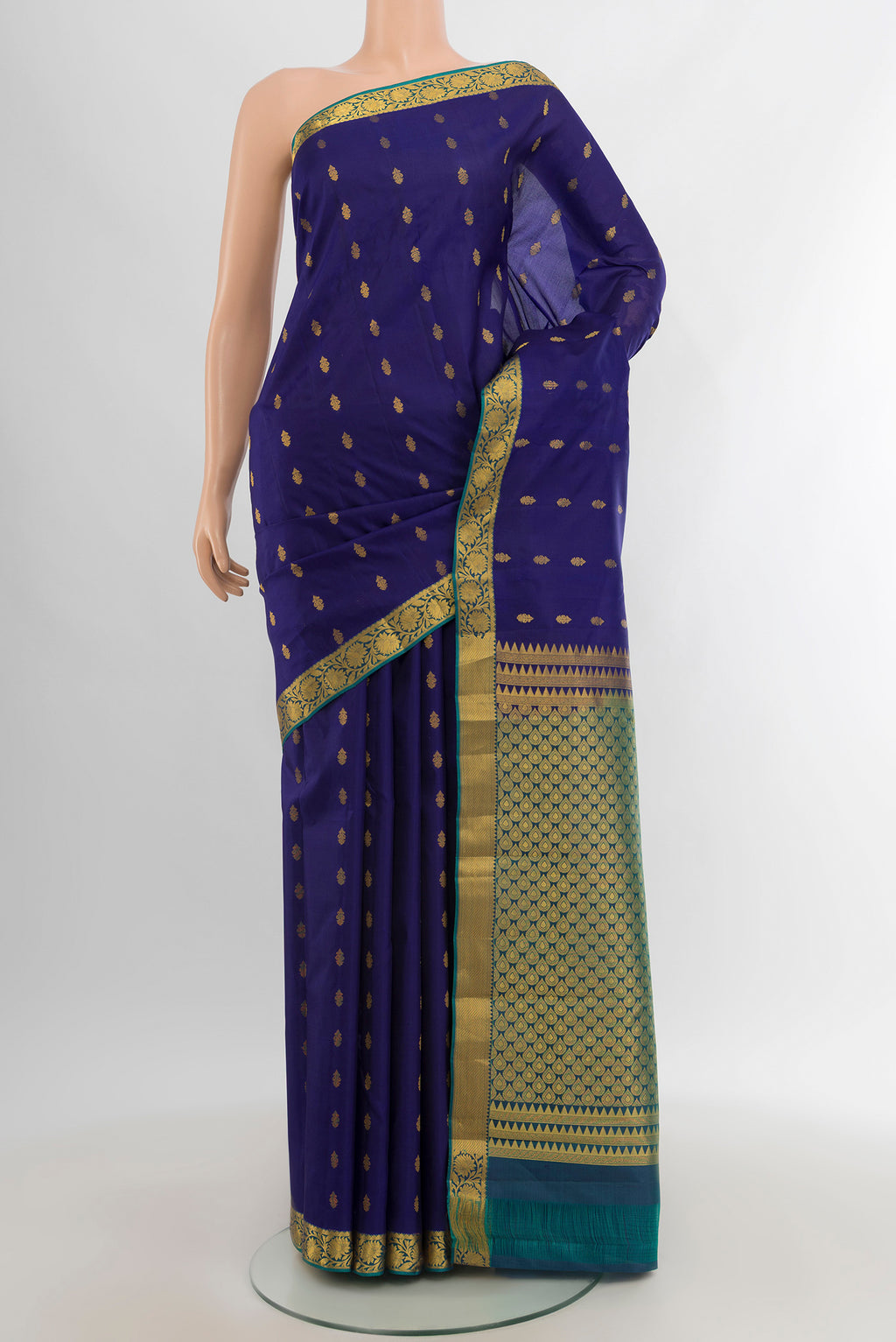 Navy Blue Kanjivaram Silk Saree with Zari Butta on the body and Zari Border.  displayed on a mannequin