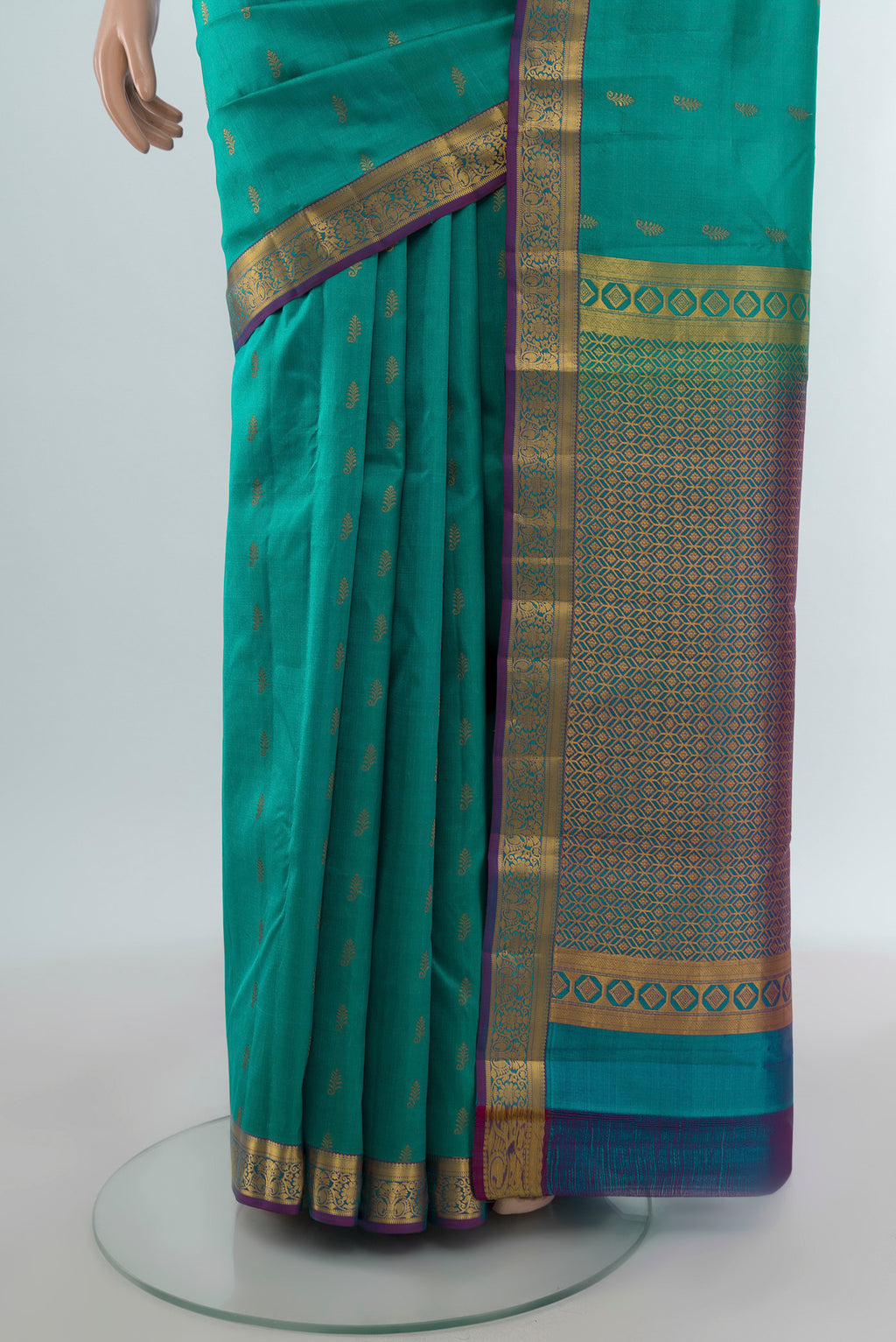 Pleats and pallu of Turquoise Kanjivaram Silk Saree with Zari Butta on the body and Zari Border. 