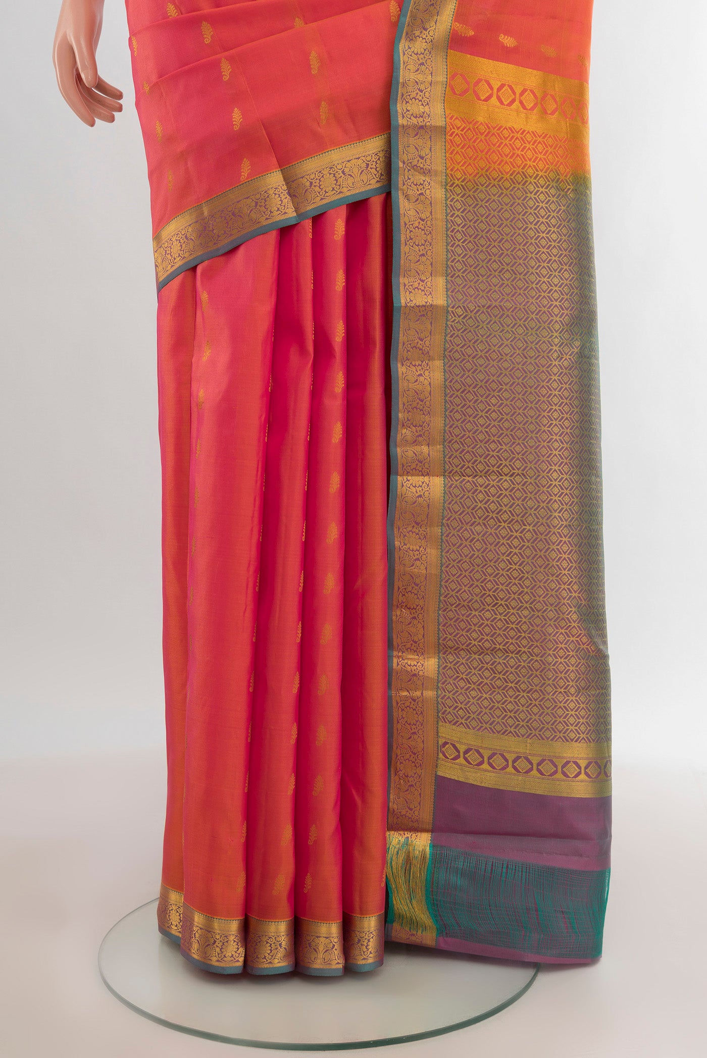 Pleats and pallu of Golden Peach Kanjivaram Silk Saree with Zari Butta on the body and Zari Border. 