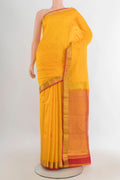 Pure Silk Yellow Kanjivaram Saree with Zari Butta on the body and Zari Border.  displayed on a mannequin