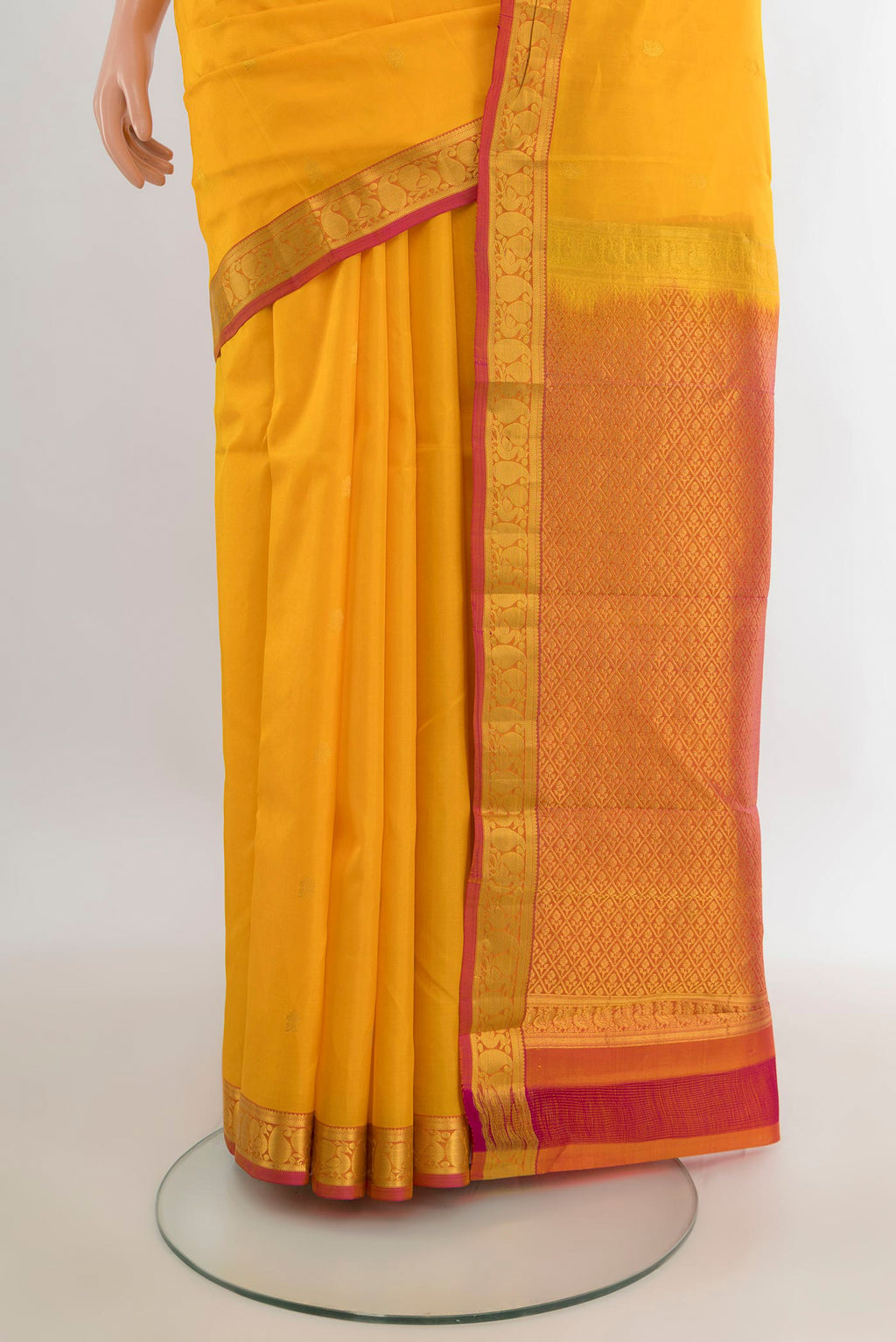 Pleats and pallu of Pure Silk Yellow Kanjivaram Saree with Zari Butta on the body and Zari Border. 