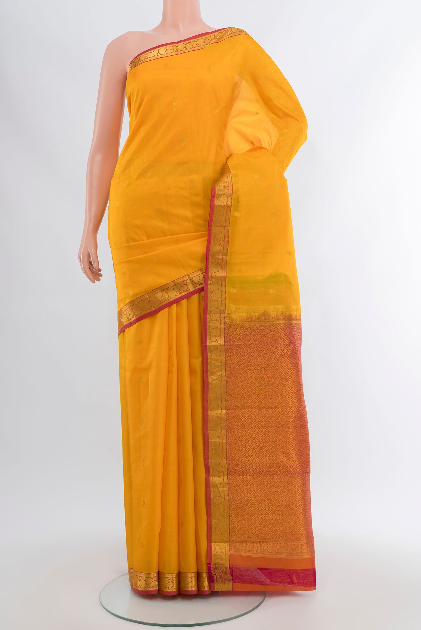 Yellow Kanjivaram Silk Saree with Zari Butta on the body and Zari Border.  displayed on a mannequin