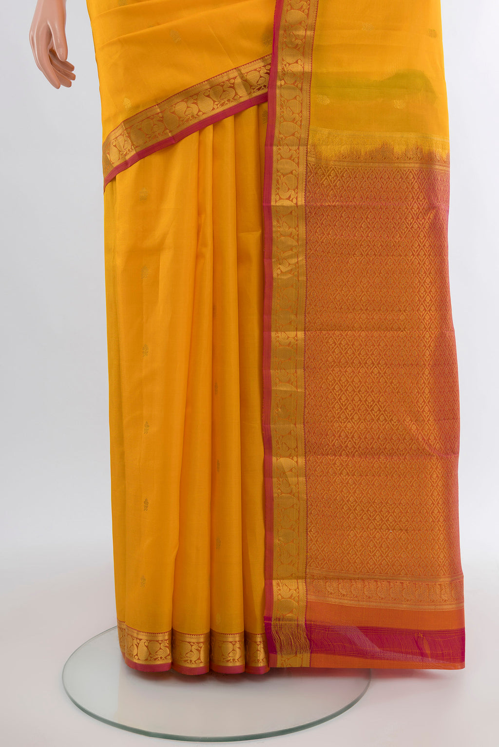 Pleats and pallu of Yellow Kanjivaram Silk Saree with Zari Butta on the body and Zari Border. 
