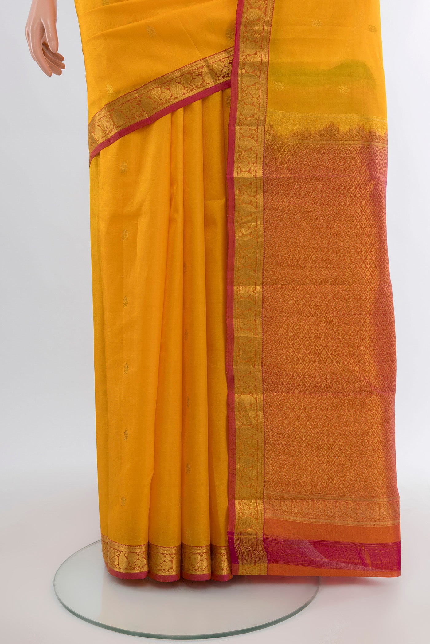 Pleats and pallu of Yellow Kanjivaram Silk Saree with Zari Butta on the body and Zari Border. 