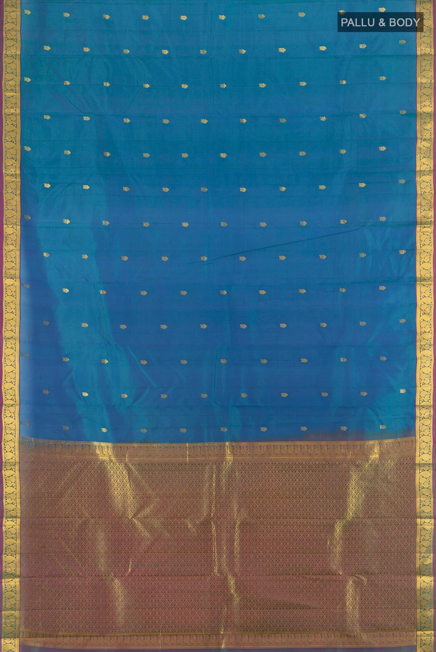 Flat view of Peacock Blue Kanjivaram Silk Saree with Zari Butta on the body and Zari Border. 