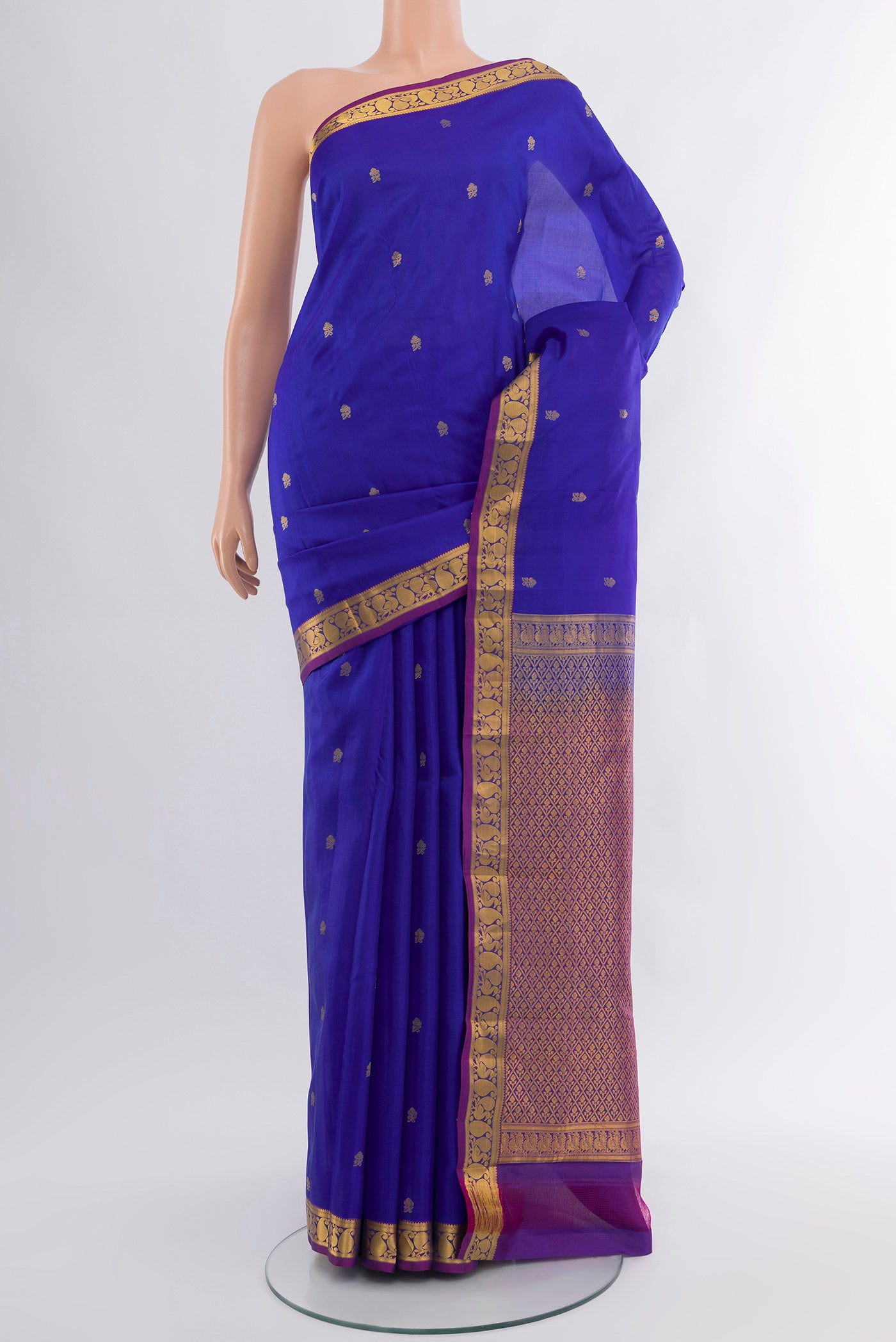 Royal Blue Kanjivaram Silk Saree with Zari Butta on the body and Zari Border.  displayed on a mannequin