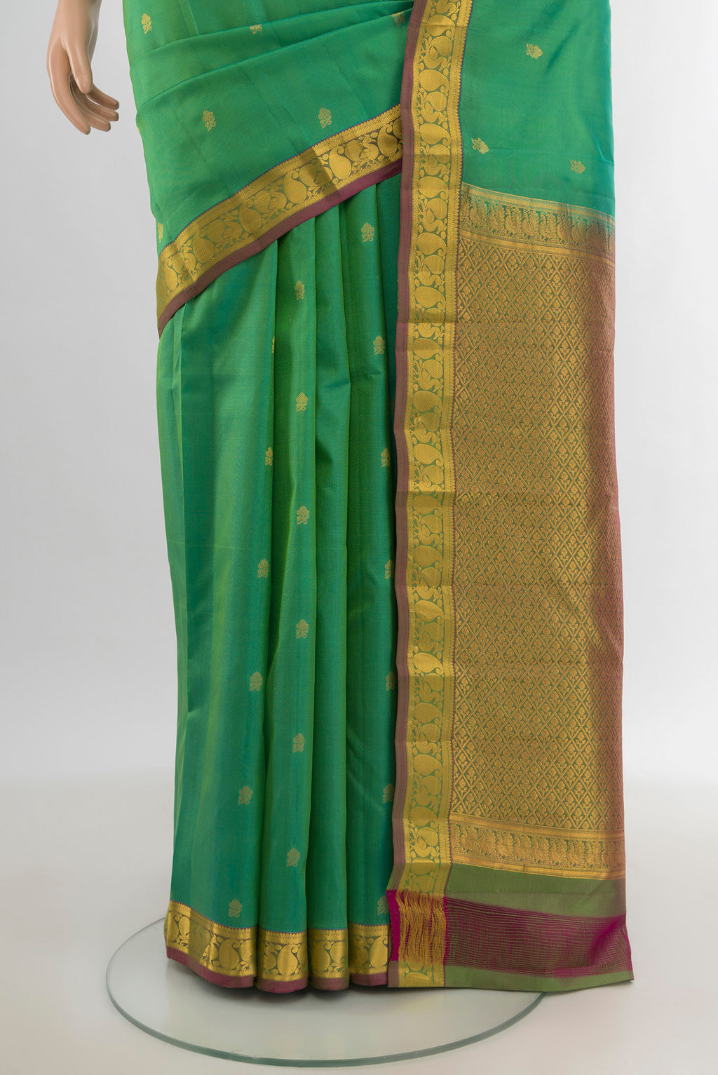Pleats and pallu of Light Green Kanjivaram Silk Saree with Zari Butta on the body and Zari Border. 