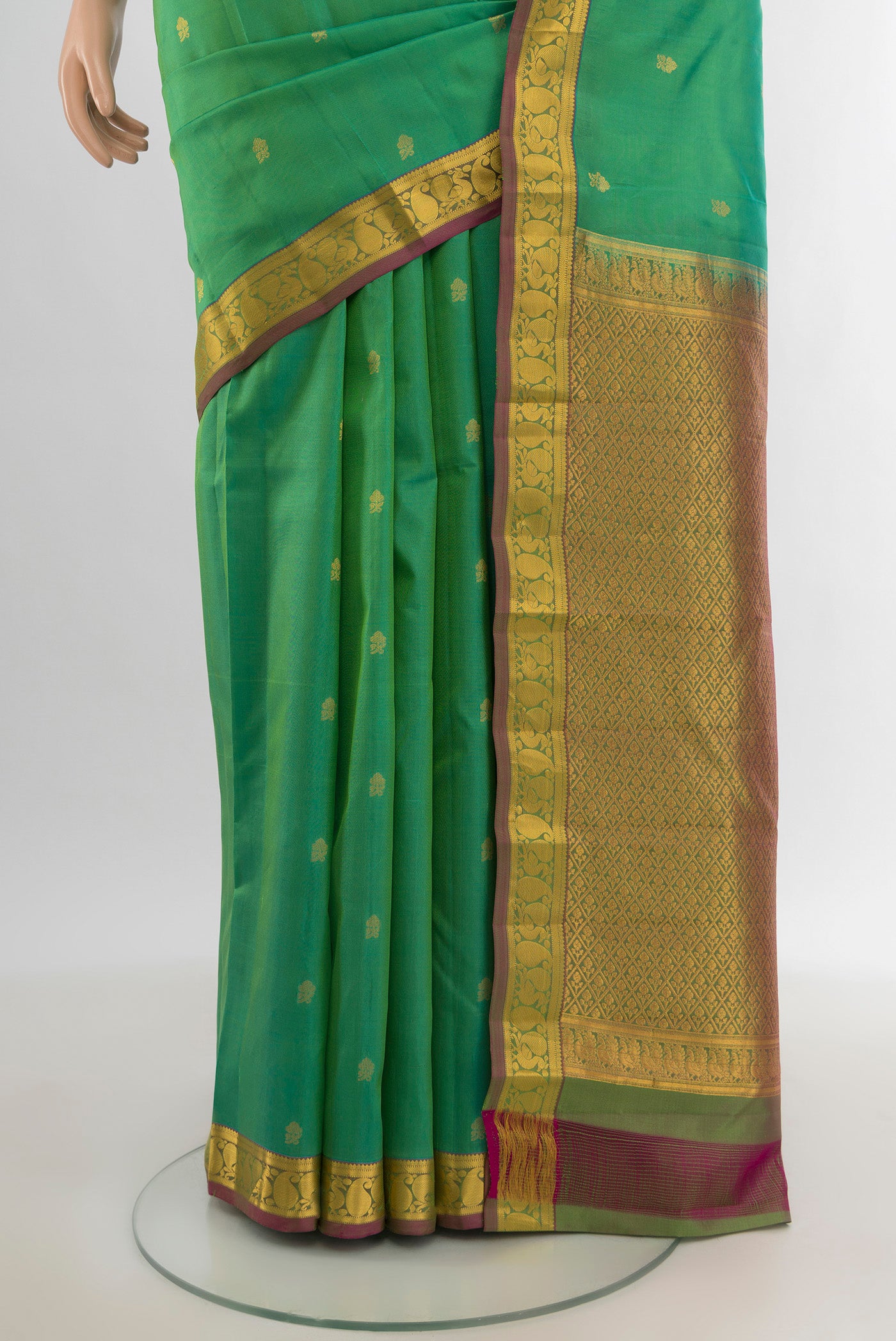 Pleats and pallu of Light Green Kanjivaram Silk Saree with Zari Butta on the body and Zari Border. 