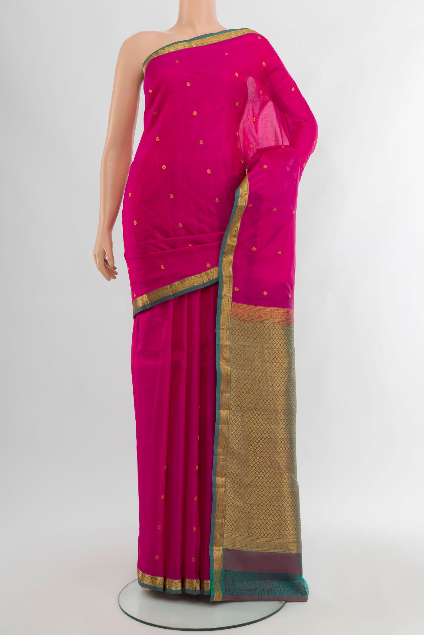 Dark Pink Kanjivaram Silk Saree with Zari Butta on the body and Zari Border.  displayed on a mannequin