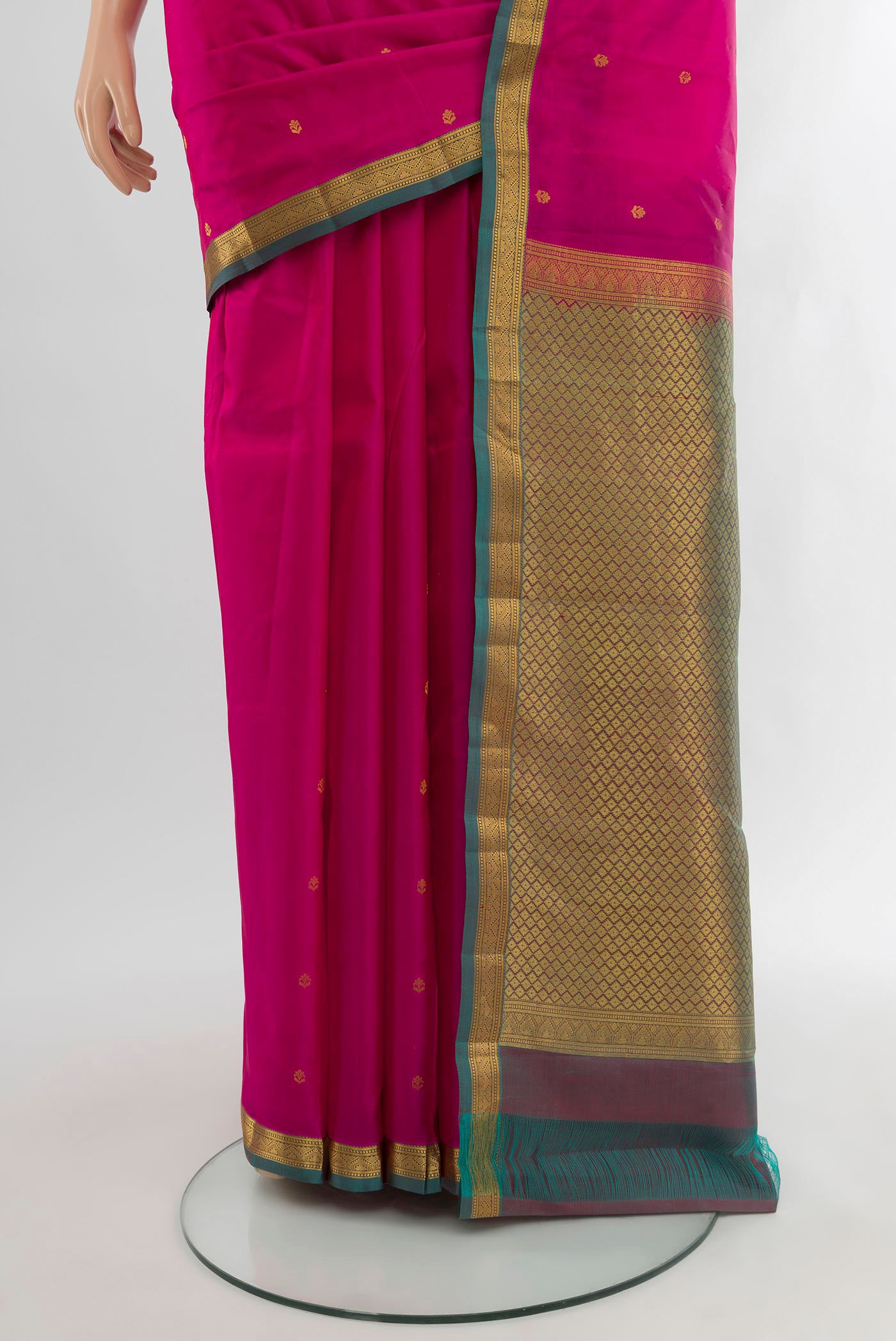 Pleats and pallu of Dark Pink Kanjivaram Silk Saree with Zari Butta on the body and Zari Border. 