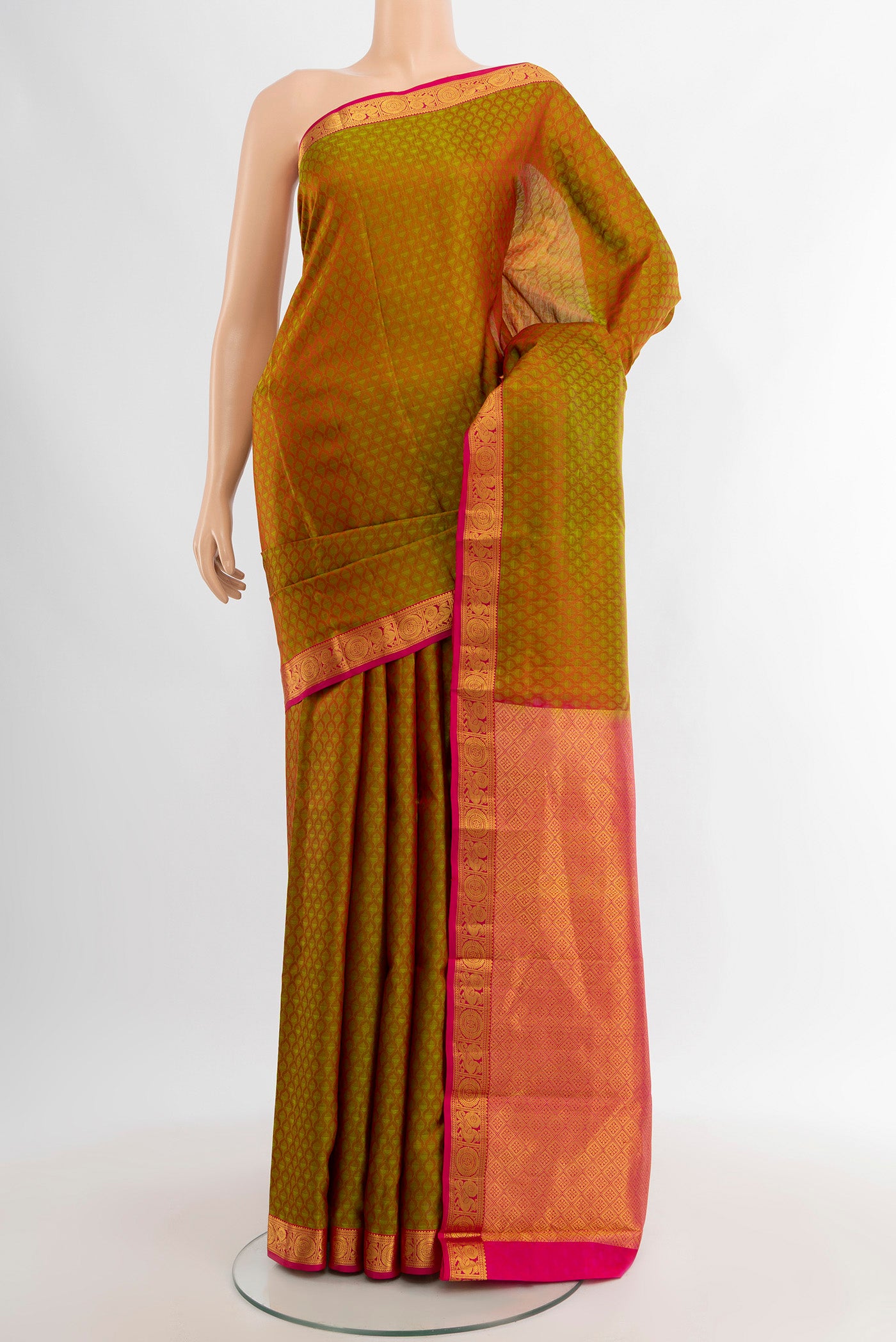 Mehandi Green Kanjivaram Silk Saree with Jacquard design on the body and Zari Border.  displayed on a mannequin