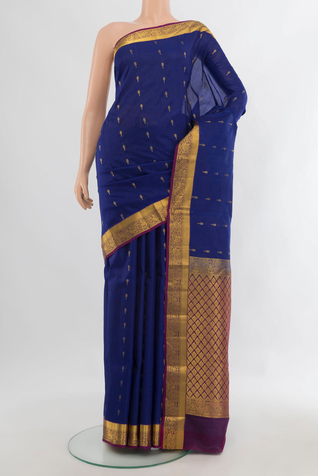 Pure Silk Royal Blue Kanjivaram Saree with Zari Butta on the body and Zari Border.  displayed on a mannequin