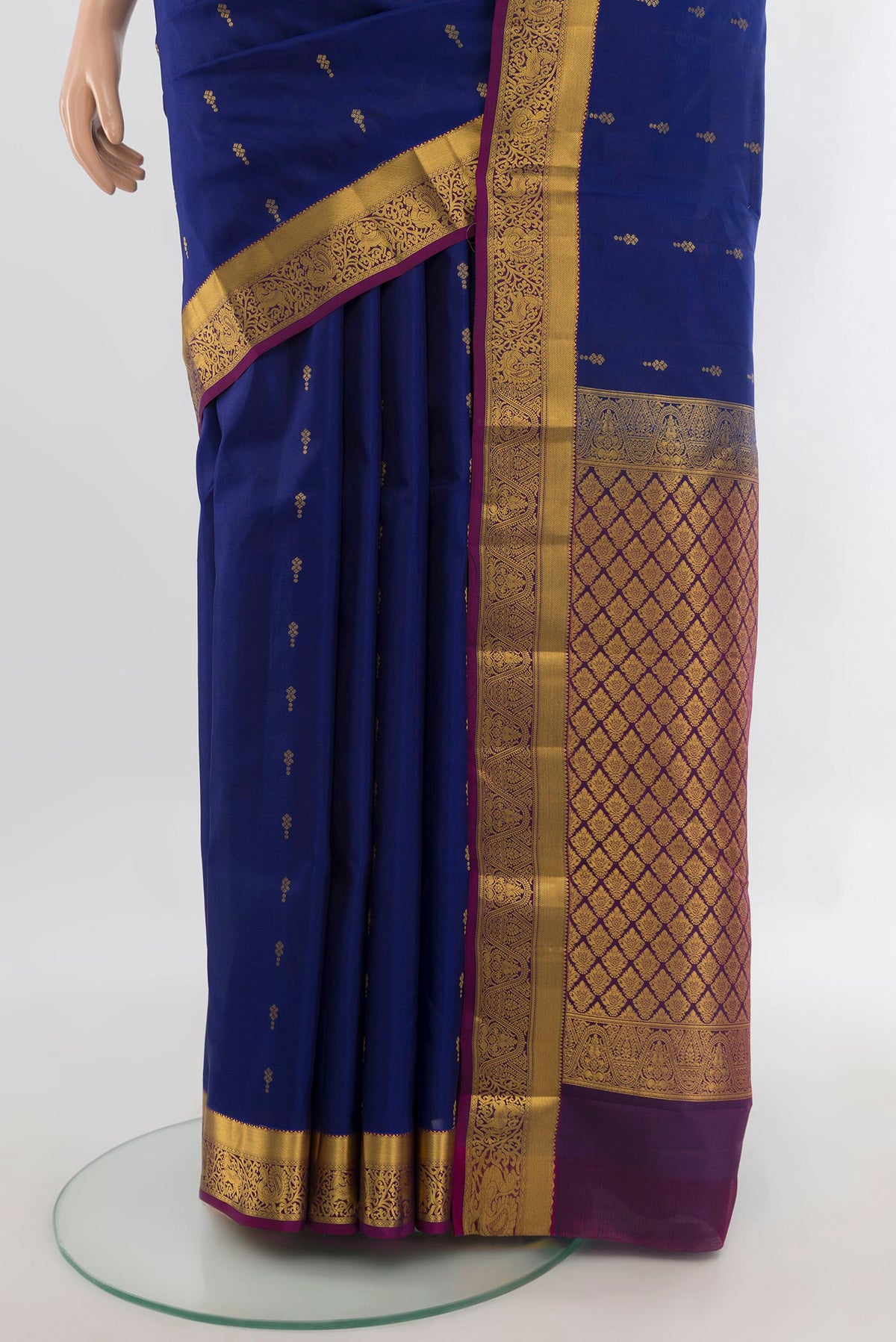 Pleats and pallu of Pure Silk Royal Blue Kanjivaram Saree with Zari Butta on the body and Zari Border. 