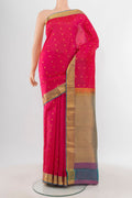 Pink Kanjivaram Silk Saree with Zari Butta on the body and Zari Border.  displayed on a mannequin