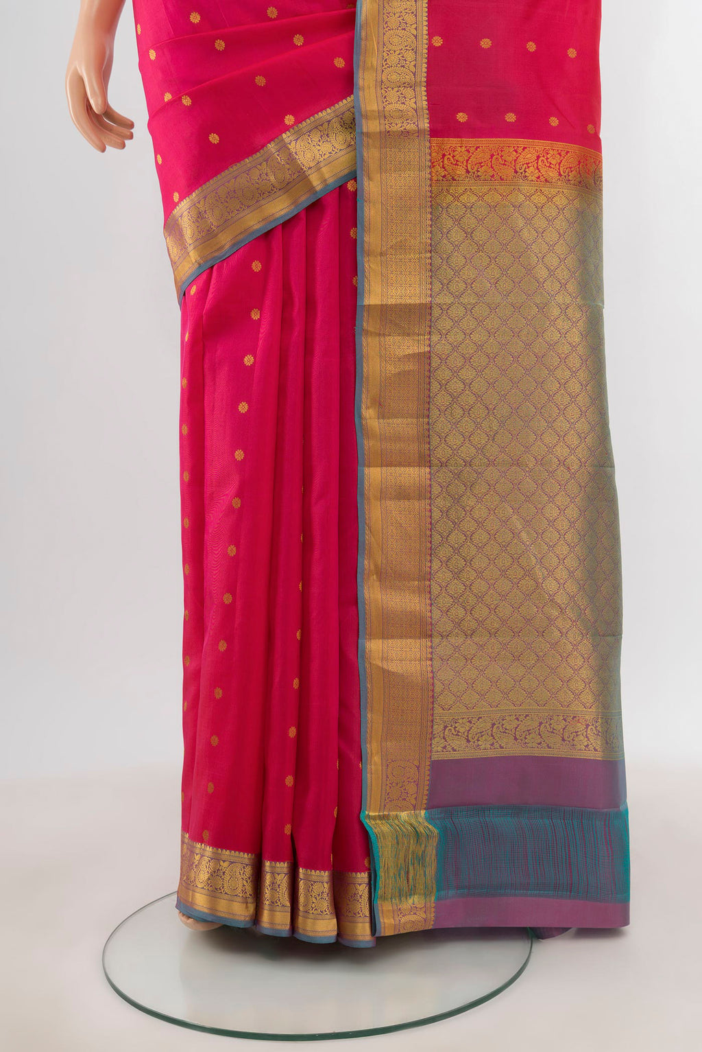 Pleats and pallu of Pink Kanjivaram Silk Saree with Zari Butta on the body and Zari Border. 
