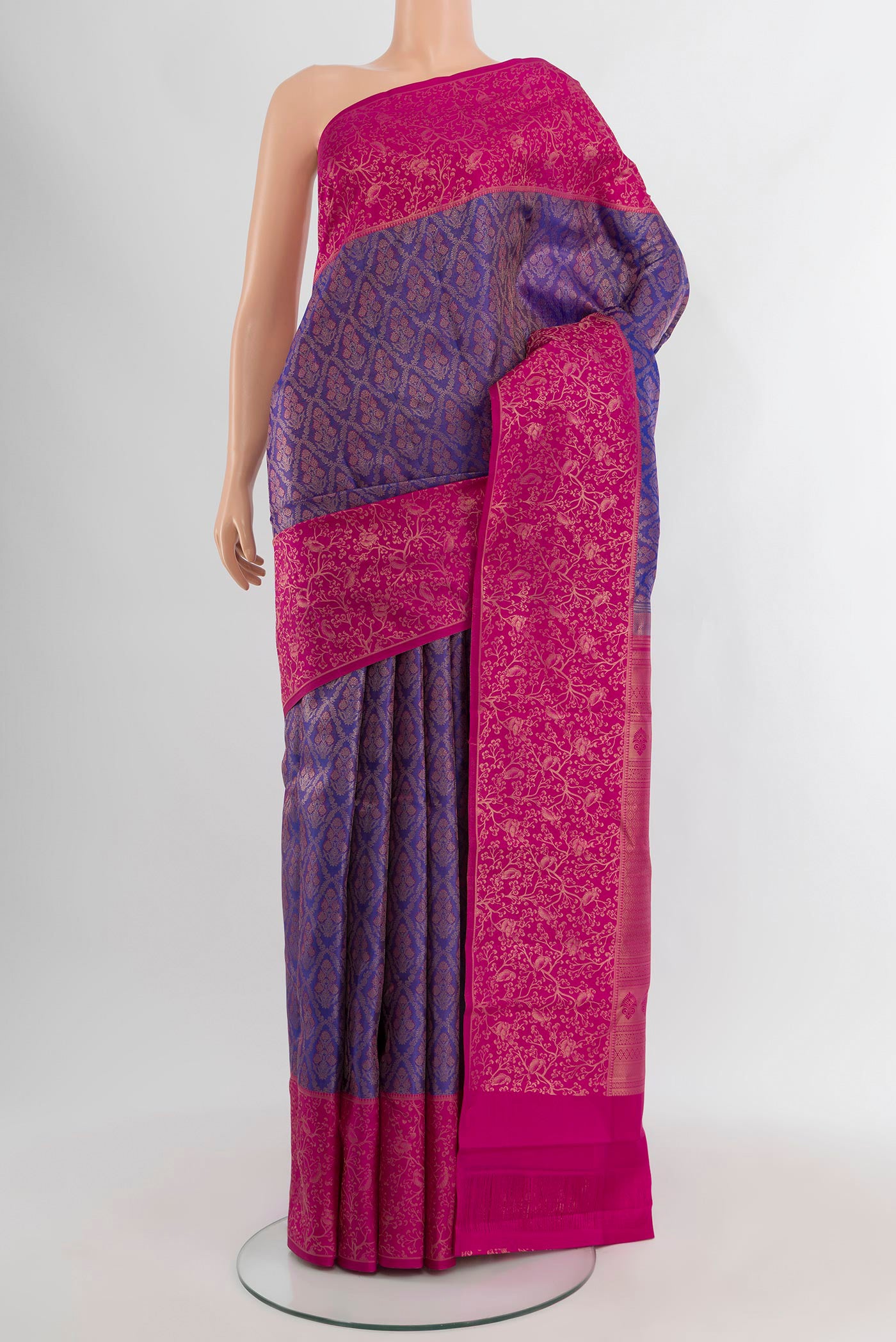 Violet Kanchipuram Silk Saree with Zari Brocade on the body and Zari Border.  displayed on a mannequin