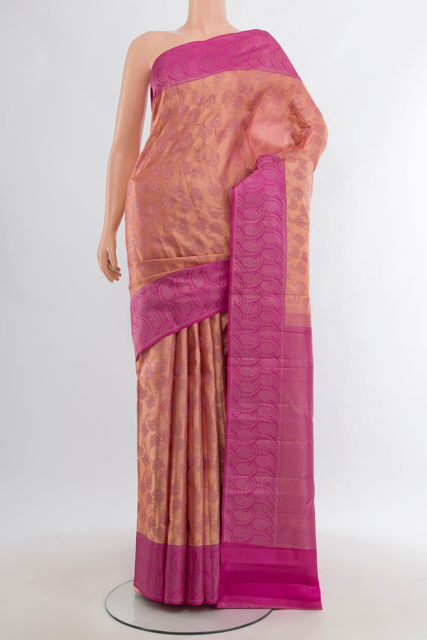 Rose Gold Kanchipuram Silk Saree with Zari Brocade on the body and Zari Border.  displayed on a mannequin