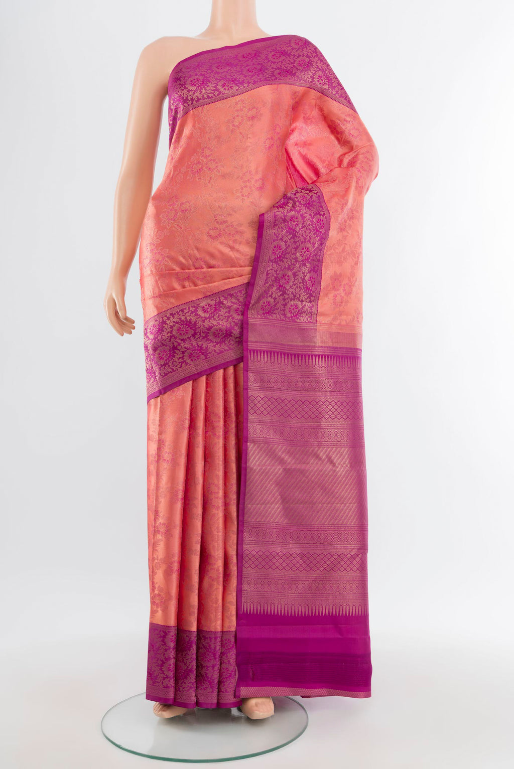 Coral Kanchipuram Silk Saree with Zari Brocade on the body and Zari Border.  displayed on a mannequin
