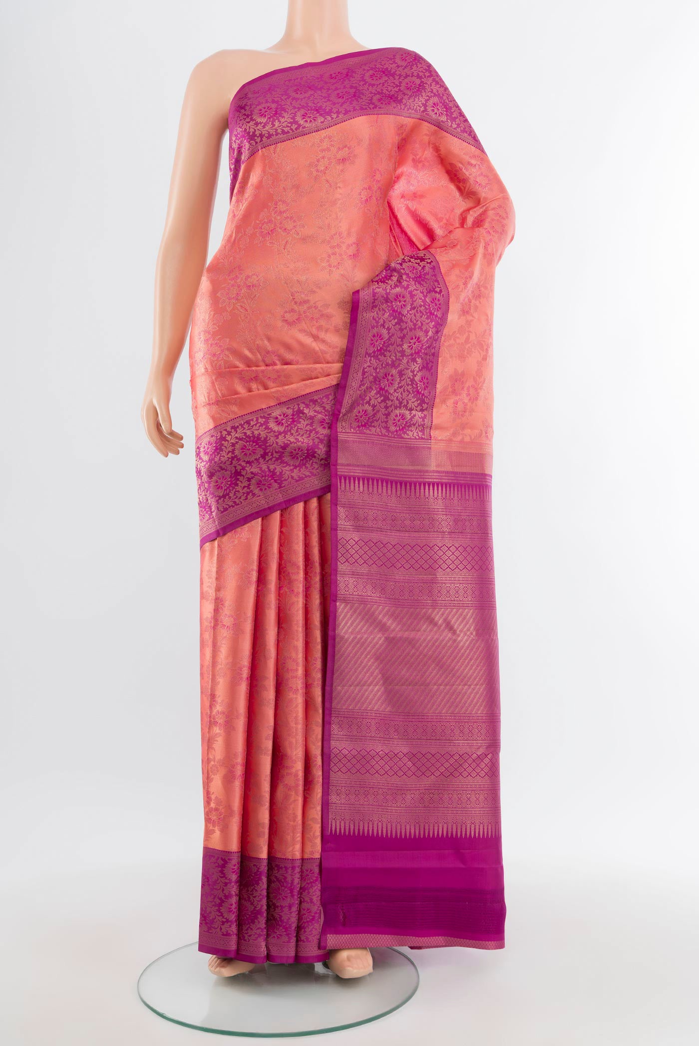 Coral Kanchipuram Silk Saree with Zari Brocade on the body and Zari Border.  displayed on a mannequin
