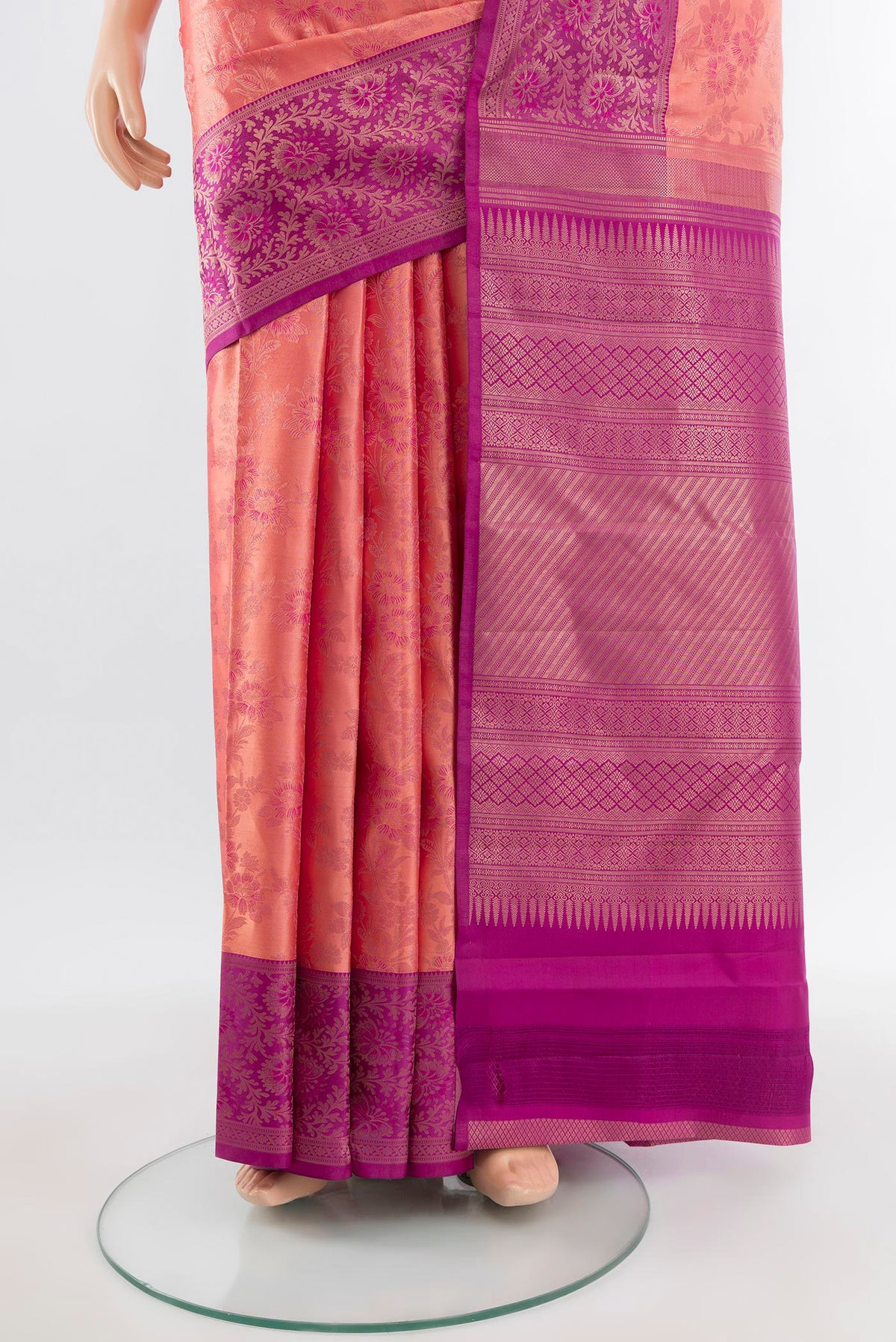 Pleats and pallu of Coral Kanchipuram Silk Saree with Zari Brocade on the body and Zari Border. 