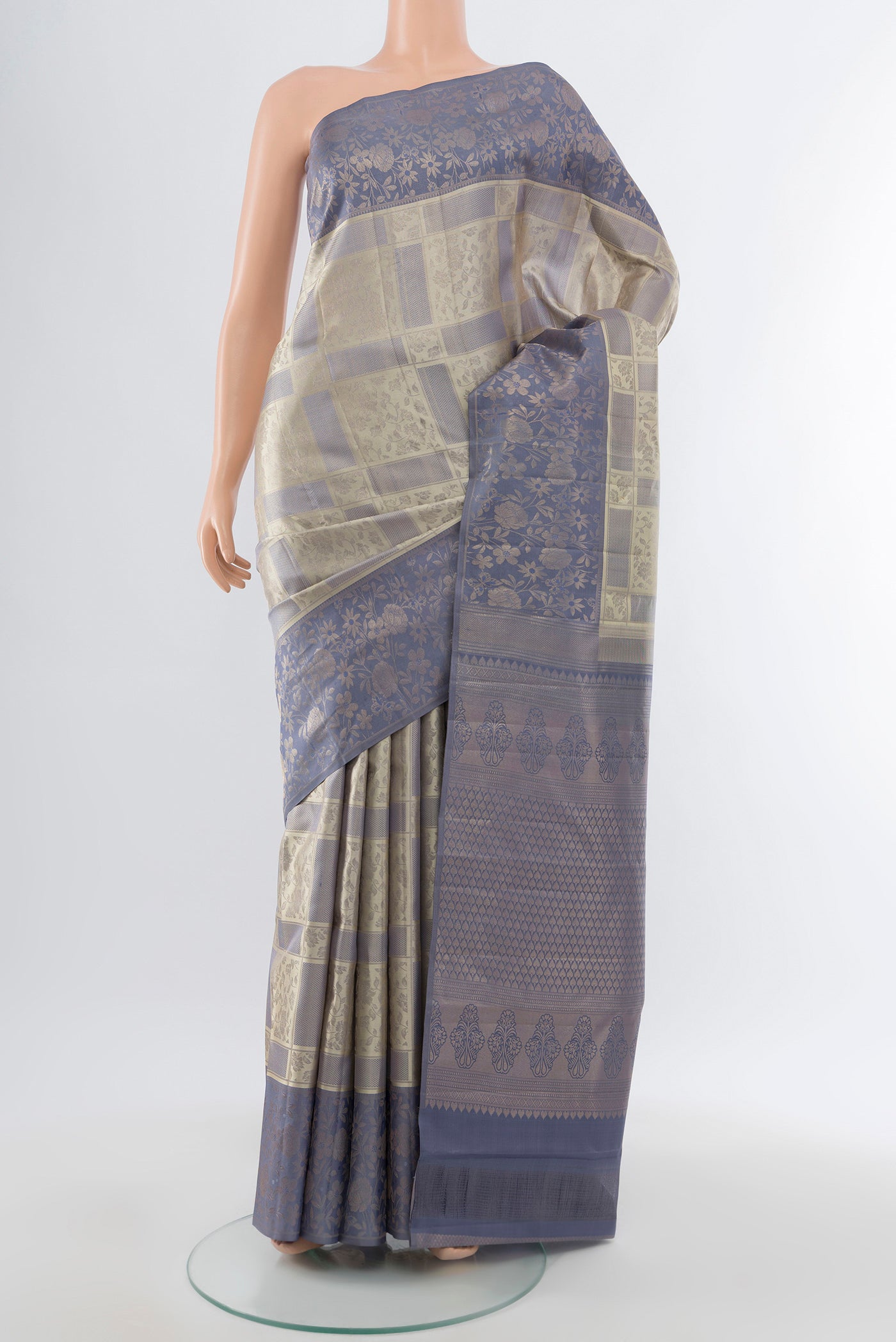 Pure Silk Pure Zari Davys Grey Kanchipuram Saree with Zari Butta on the body and Silk Border.  displayed on a mannequin