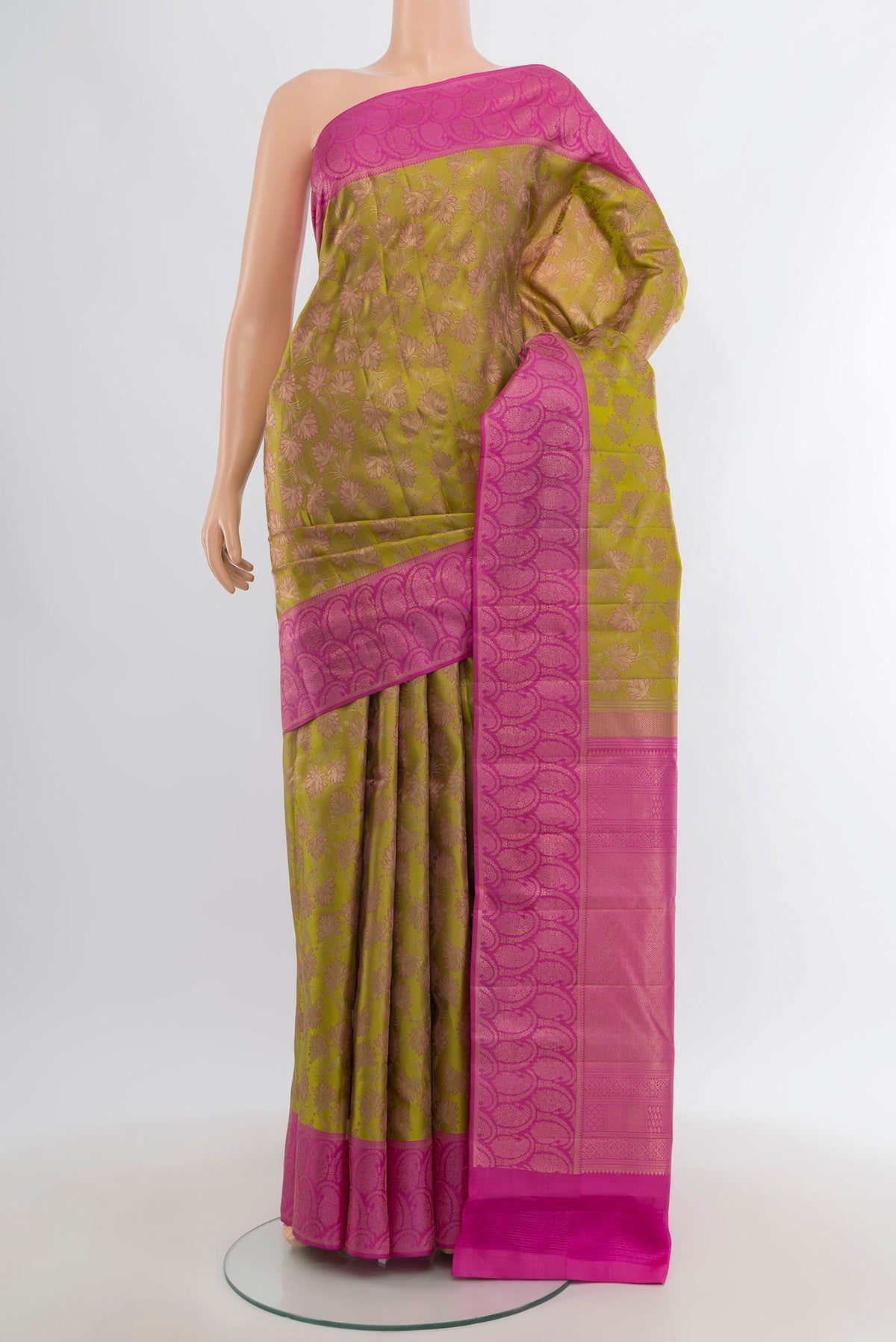 Mehandi Green Kanchipuram Silk Saree with Zari Brocade on the body and Zari Border.  displayed on a mannequin