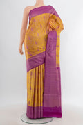 Mustard Kanchipuram Silk Saree with Zari Brocade on the body and Zari Border.  displayed on a mannequin
