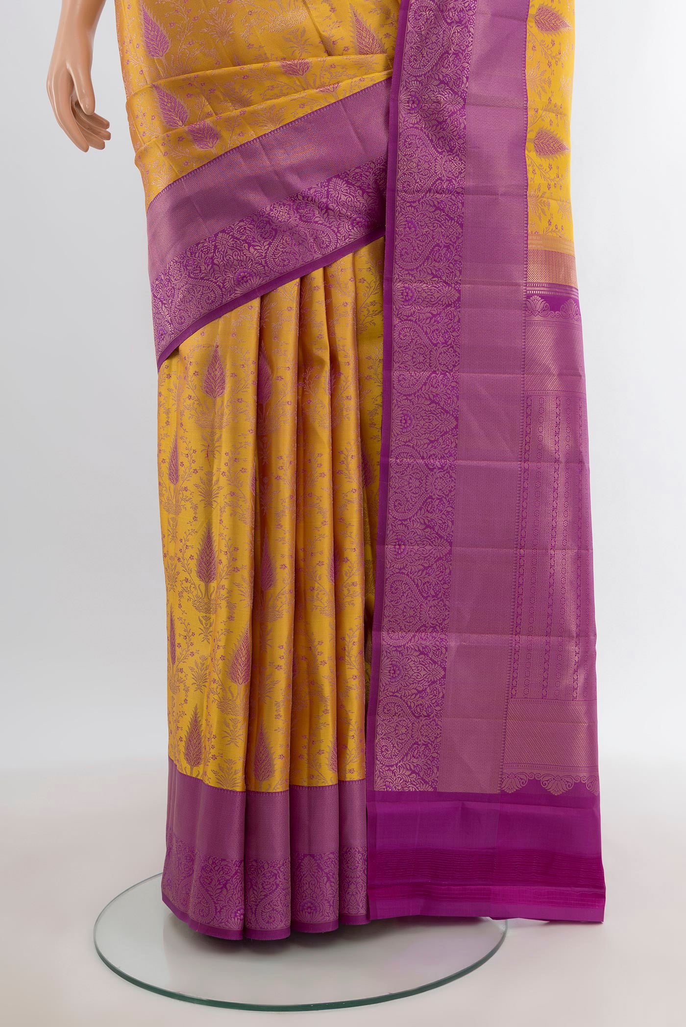 Pleats and pallu of Mustard Kanchipuram Silk Saree with Zari Brocade on the body and Zari Border. 