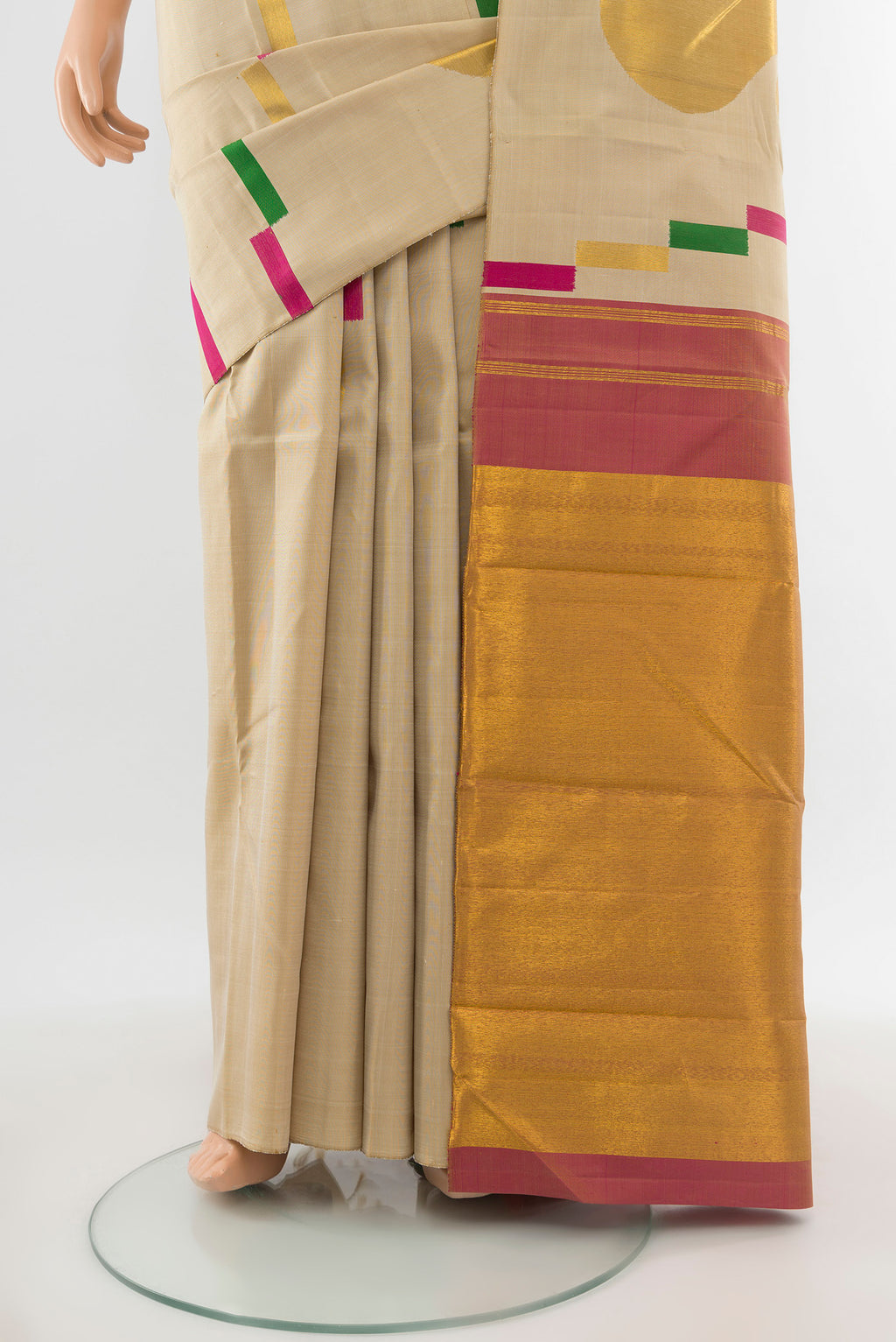 Pleats and pallu of Pure Silk Pure Zari Beige Kanjivaram Saree with Zari Butta on the body and Silk Border. 
