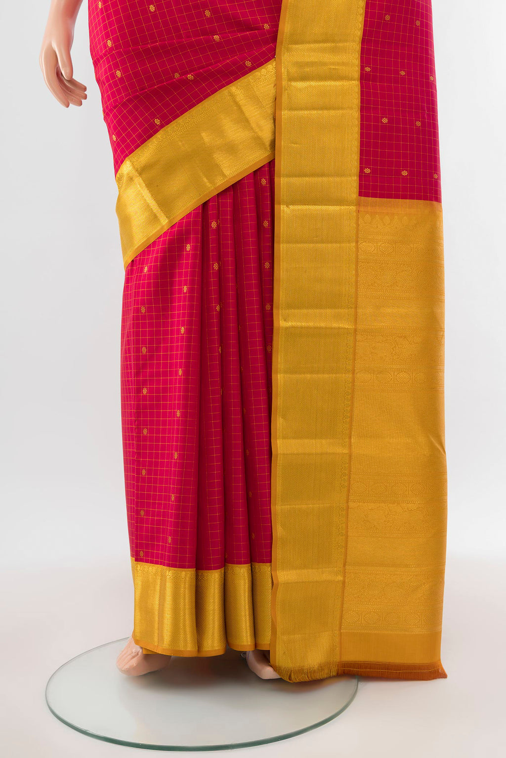 Pleats and pallu of Maroon Kanjivaram Silk Saree with Zari Butta on the body and Silk Border. 