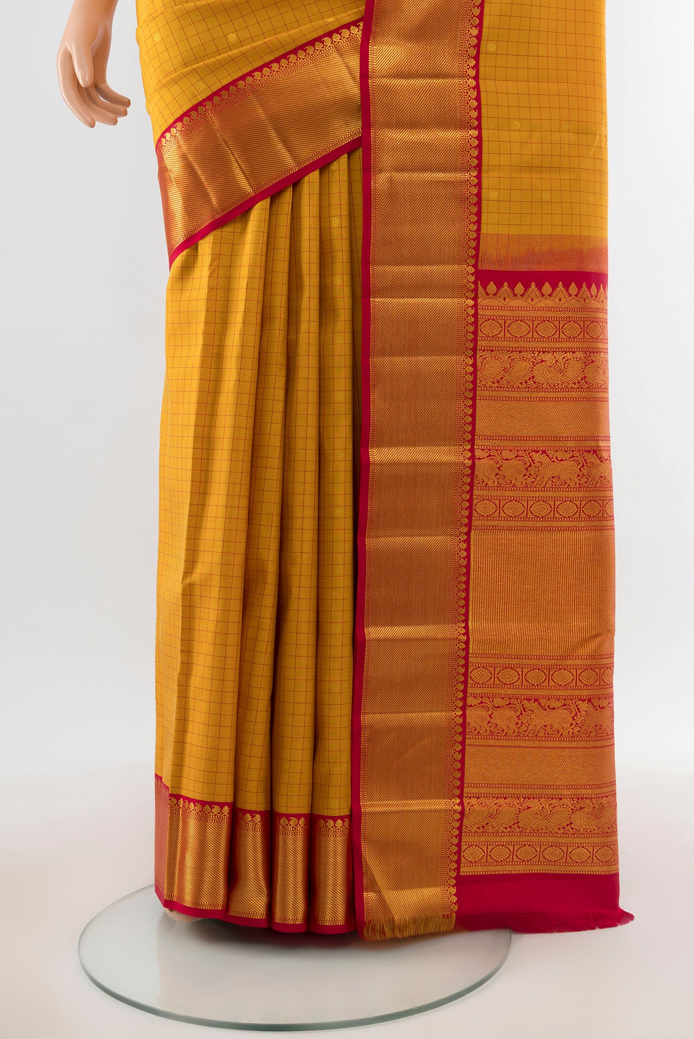 Pleats and pallu of Pure Silk Pure Zari Yellow Kanjivaram Saree with Zari Butta on the body and Silk Border. 