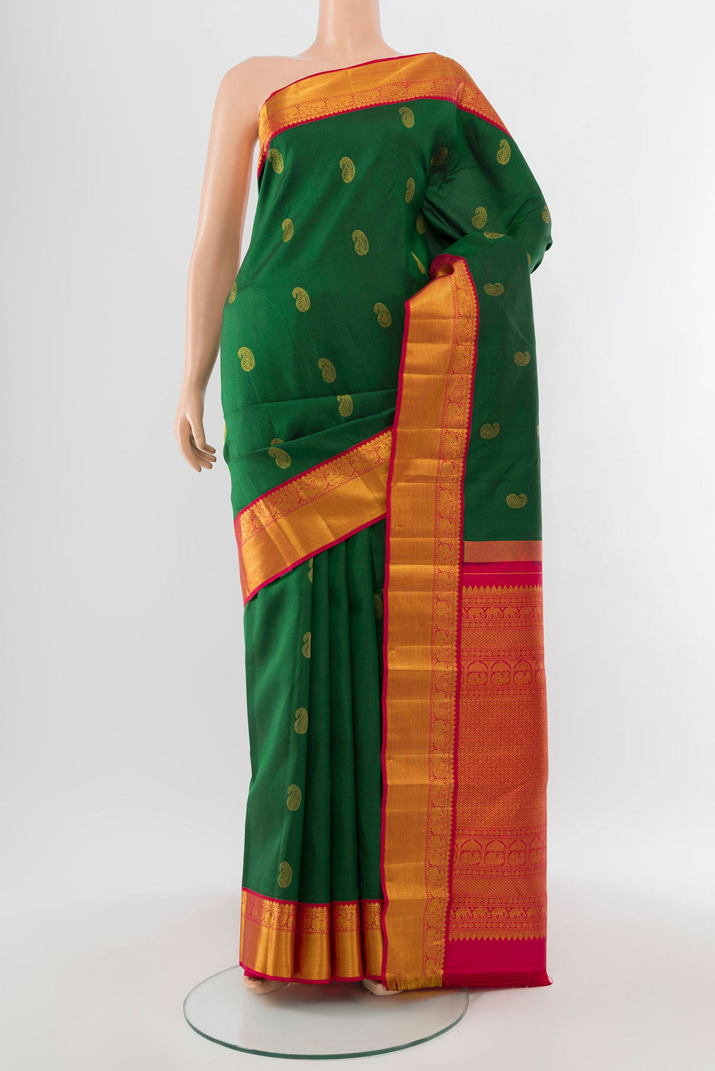 Mint Green Kanjivaram Silk Saree with Zari Butta on the body and Silk Border.  displayed on a mannequin