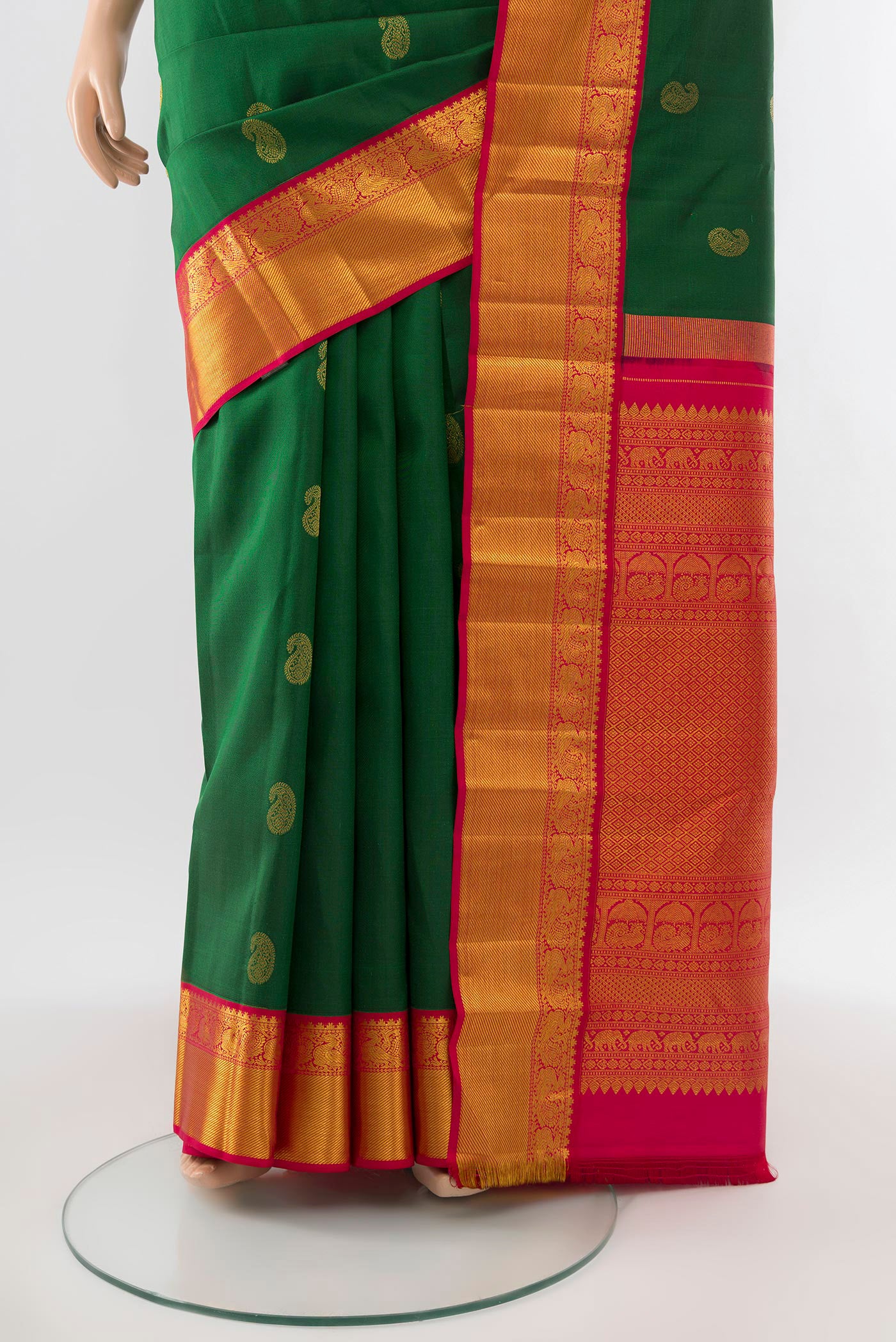 Pleats and pallu of Mint Green Kanjivaram Silk Saree with Zari Butta on the body and Silk Border. 