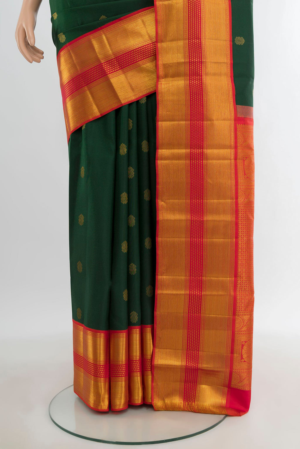 Pleats and pallu of Bottle Green Kanjivaram Silk Saree with Zari Butta on the body and Zari Border. 