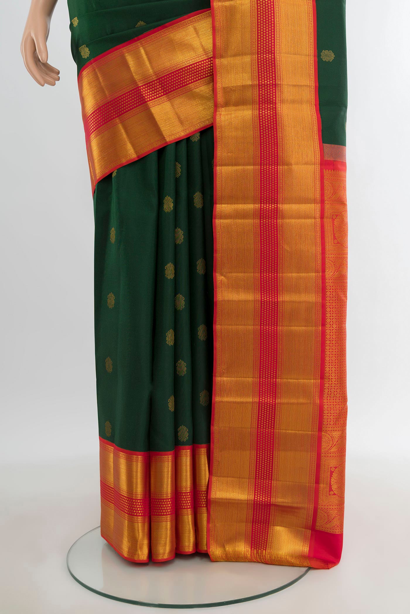 Pleats and pallu of Bottle Green Kanjivaram Silk Saree with Zari Butta on the body and Zari Border. 