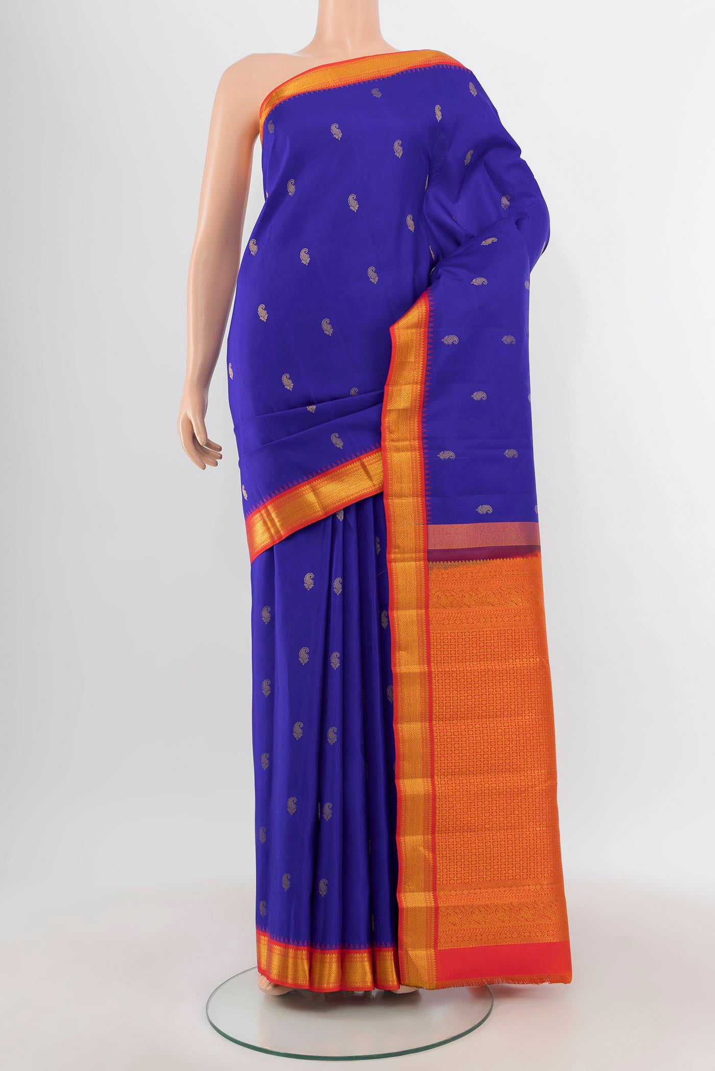 Royal Blue Kanchipuram Silk Saree with Zari Butta on the body and Zari Border.  displayed on a mannequin