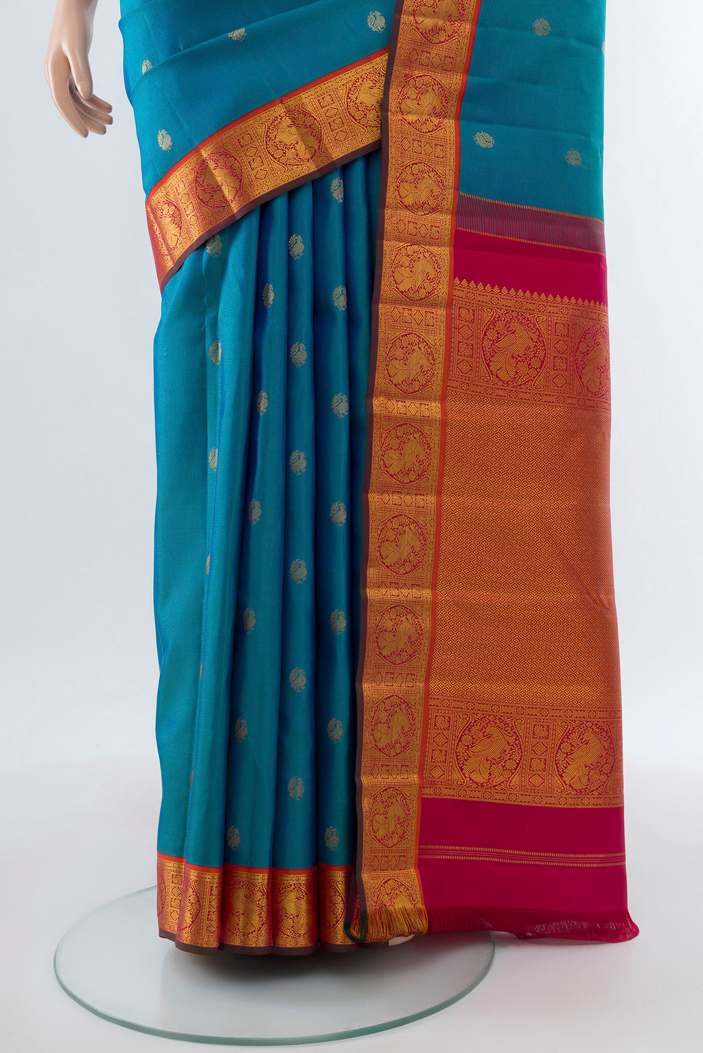 Pleats and pallu of Pure Silk Pure Zari Dark Blue Kanchipuram Saree with Zari Butta on the body and Silk Border. 