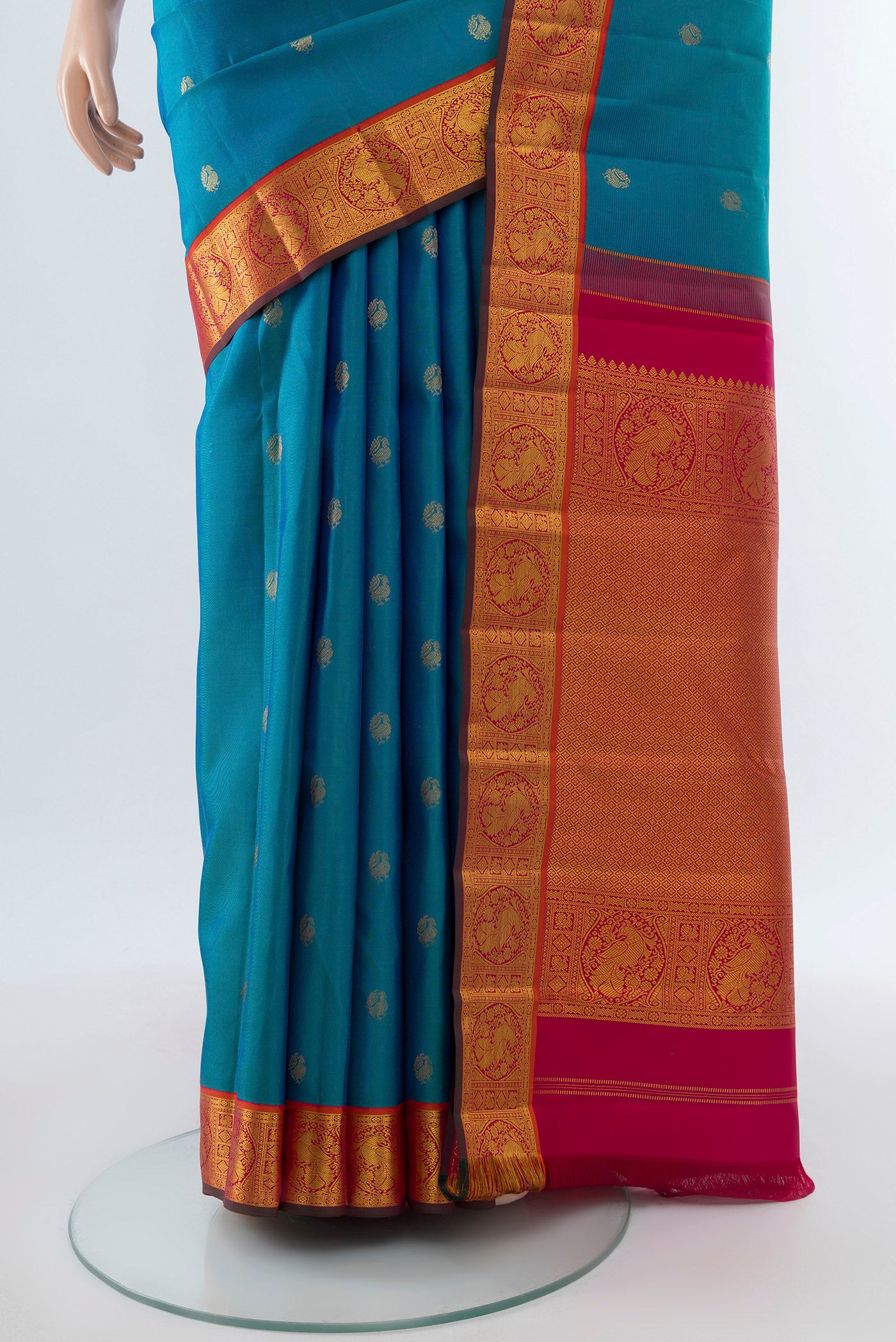 Pleats and pallu of Pure Silk Pure Zari Dark Blue Kanchipuram Saree with Zari Butta on the body and Silk Border. 