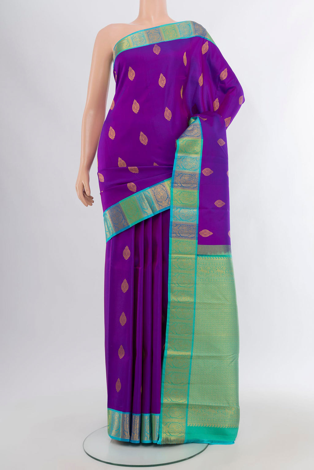 Purple Kanchipuram Silk Saree with Zari Butta on the body and Zari Border.  displayed on a mannequin
