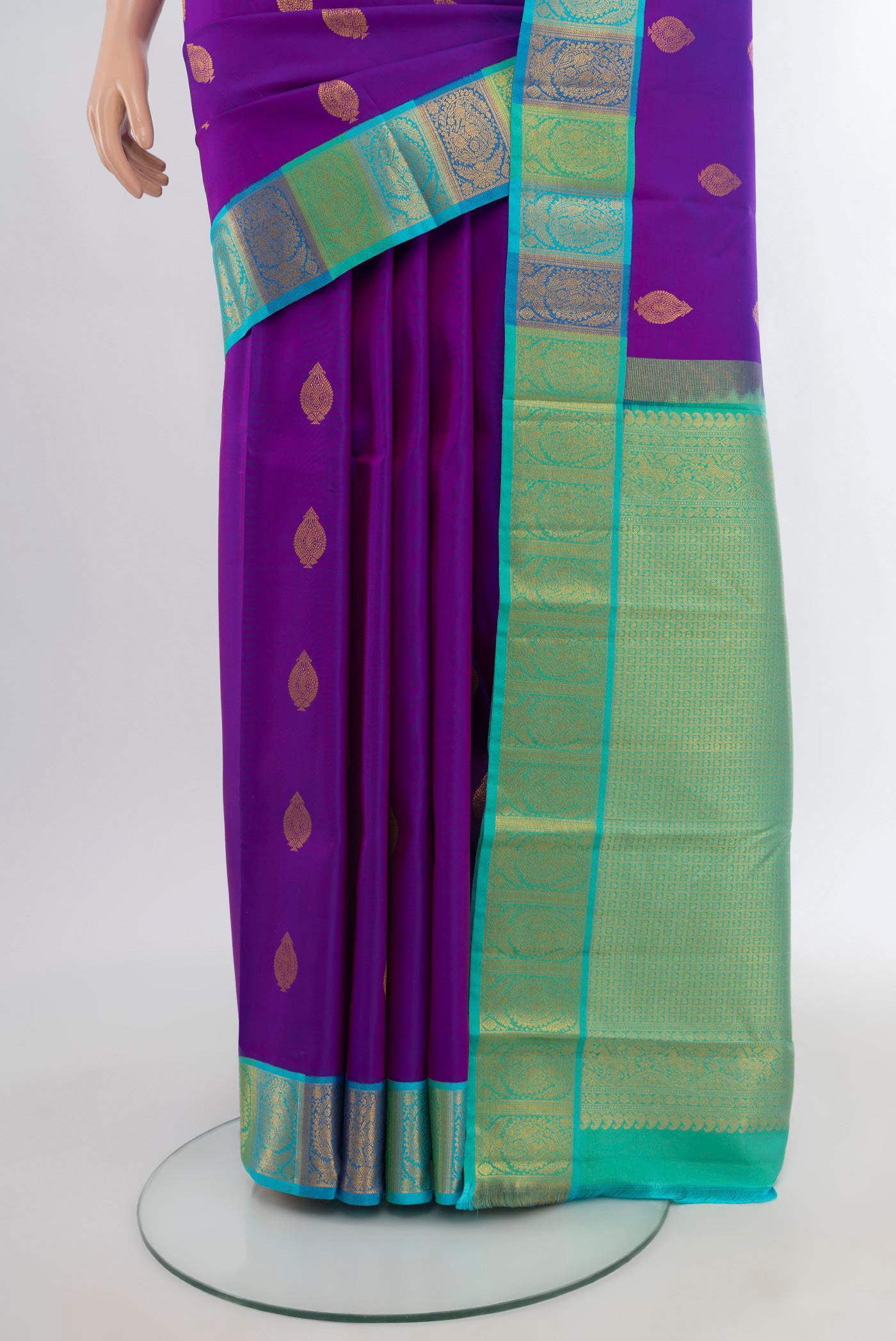 Pleats and pallu of Purple Kanchipuram Silk Saree with Zari Butta on the body and Zari Border. 