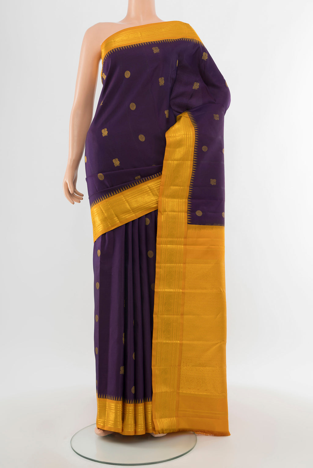 Pure Silk Pure Zari Violet Kanchipuram Saree with Zari Butta on the body and Silk Border.  displayed on a mannequin