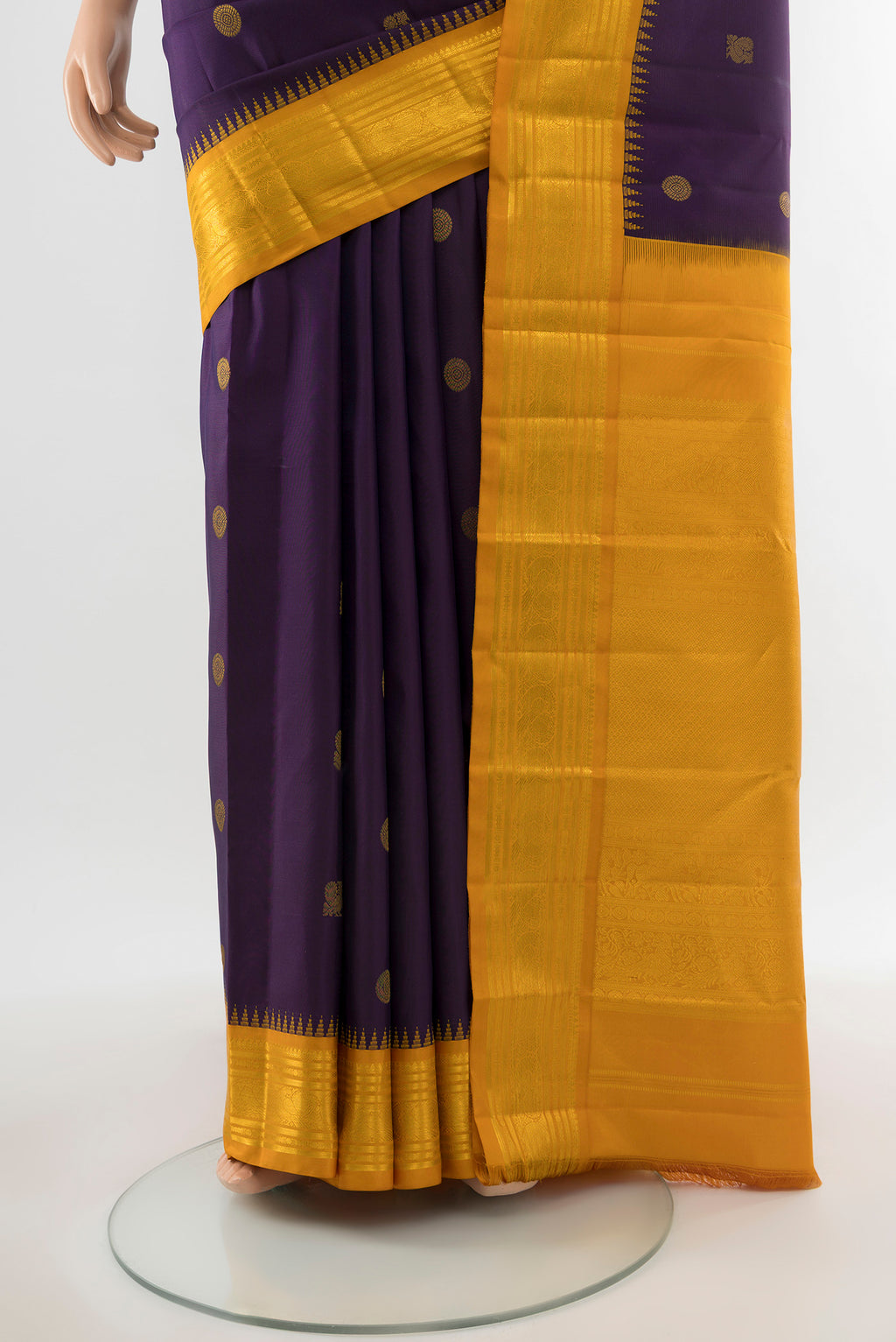 Pleats and pallu of Pure Silk Pure Zari Violet Kanchipuram Saree with Zari Butta on the body and Silk Border. 